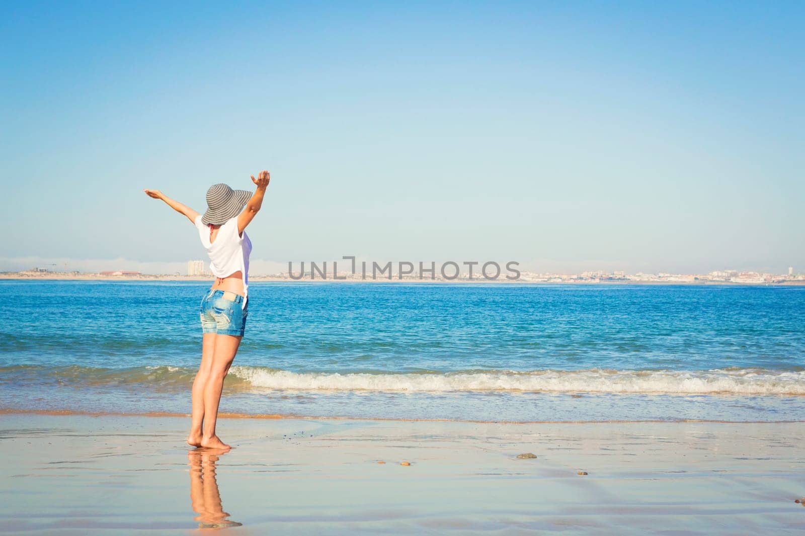 Beautiful young woman enjoying the beach