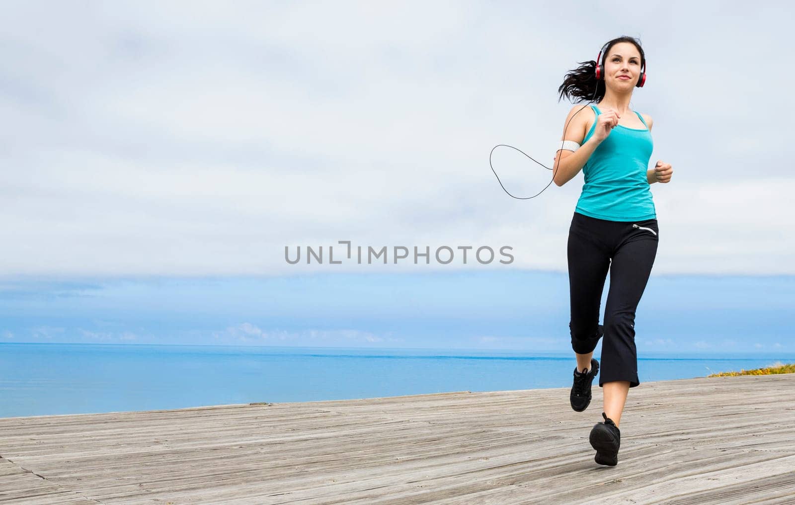 Beautiful young woman in outdoor doing yoga