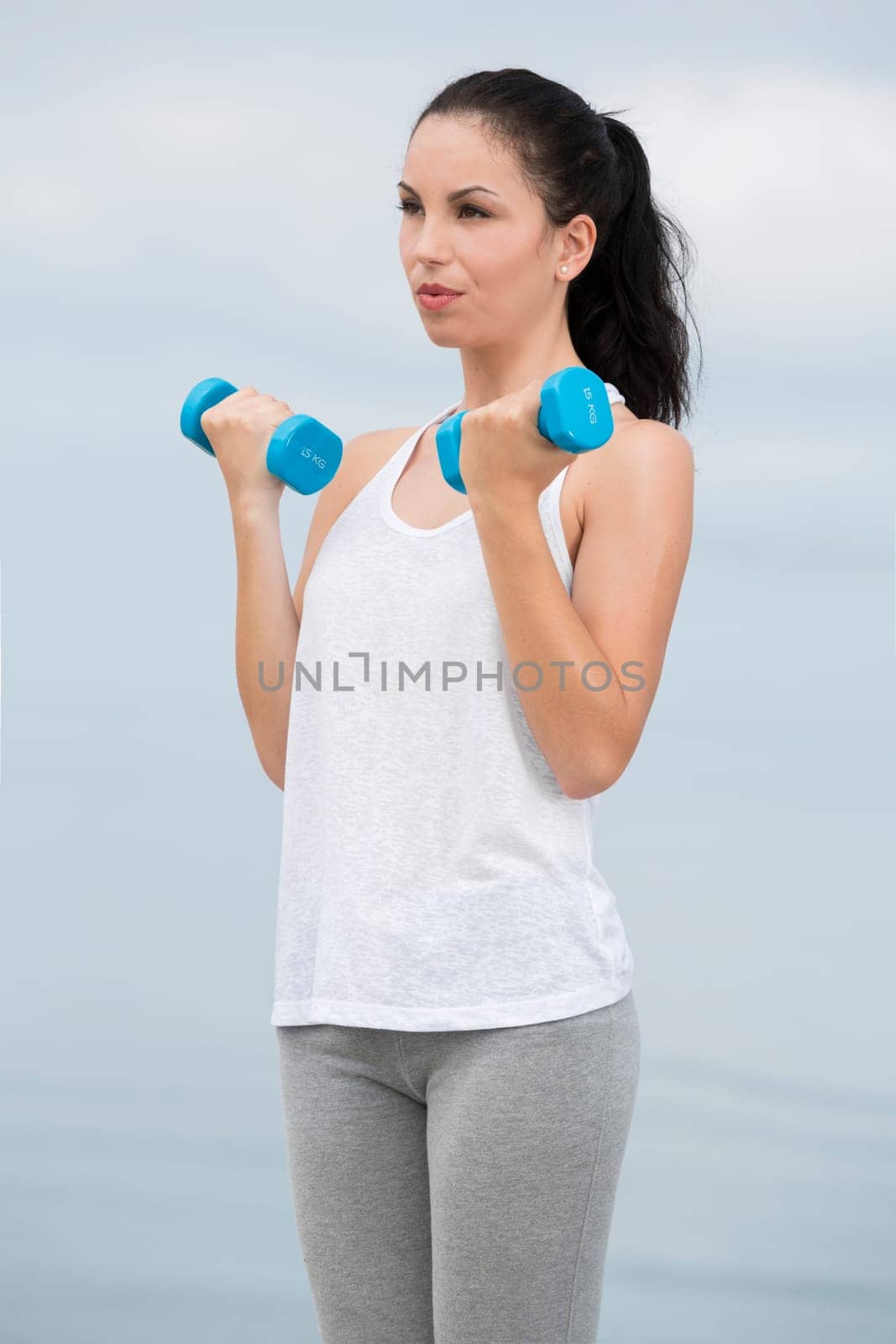 Beautiful young woman in outdoor doing yoga