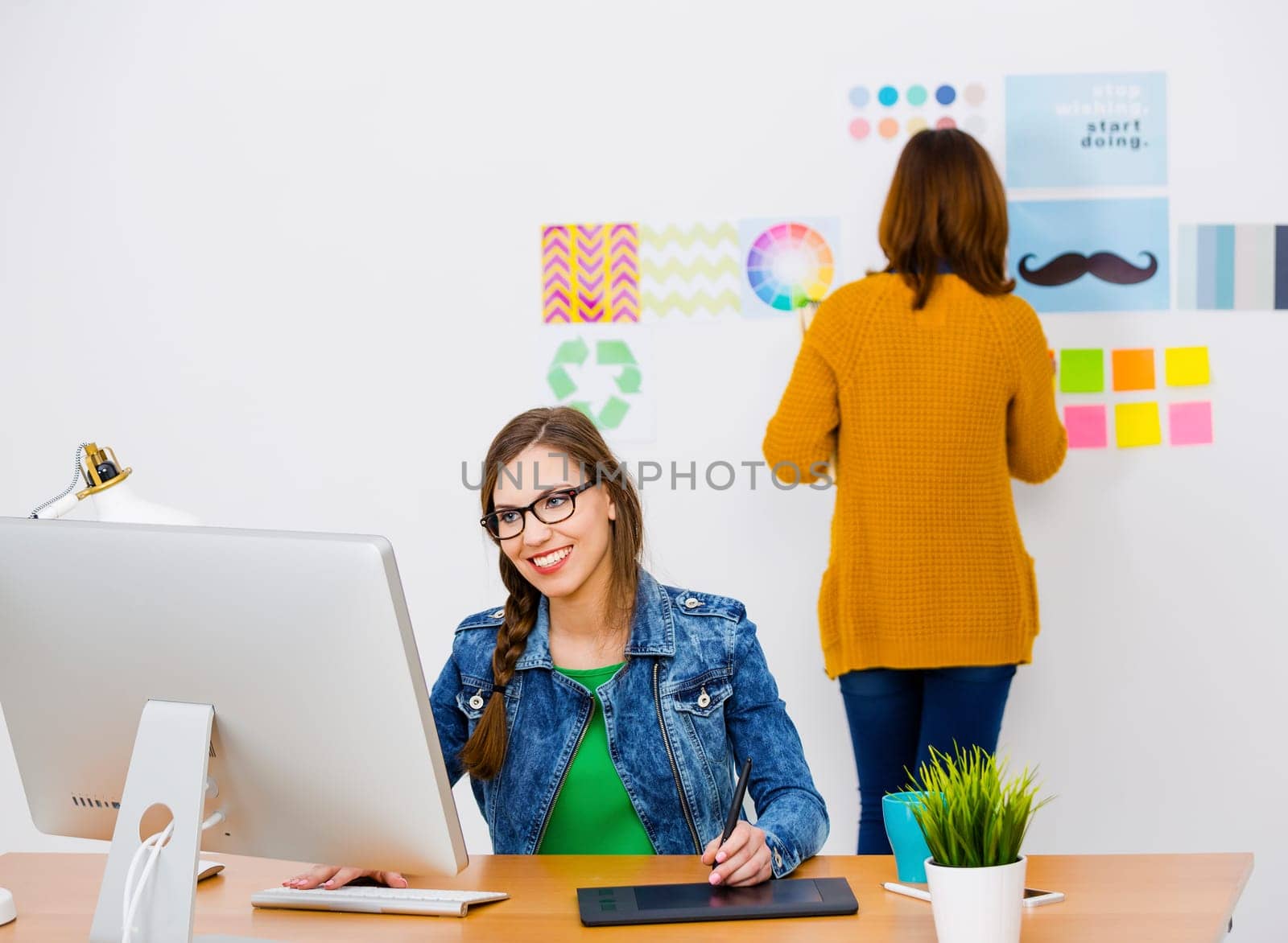 Women working at desk In a creative office, team work