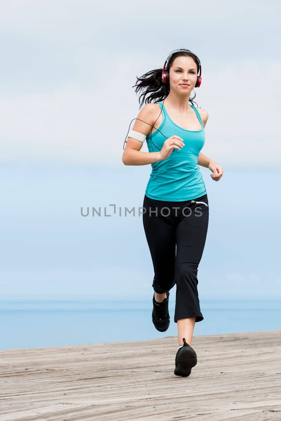 Beautiful young woman in outdoor doing yoga