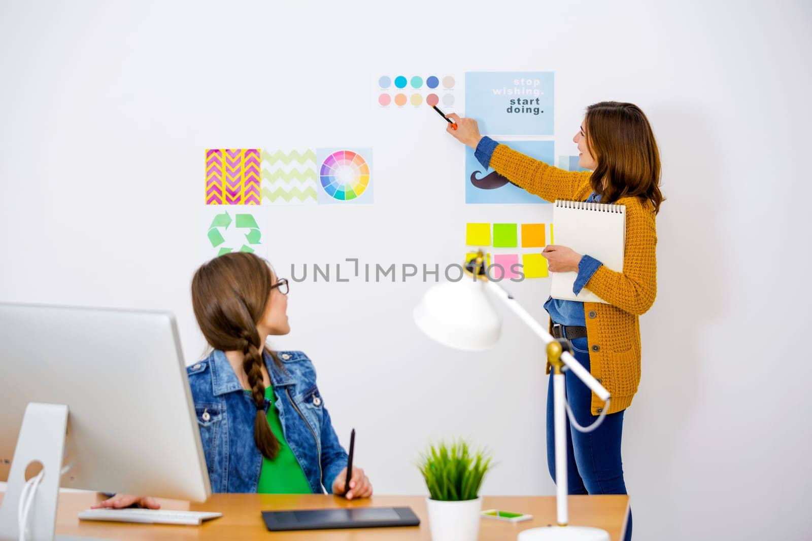 Women working at desk In a creative office, team work