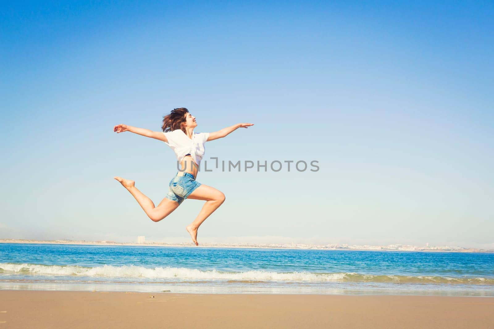 Beautiful young woman enjoying the beach