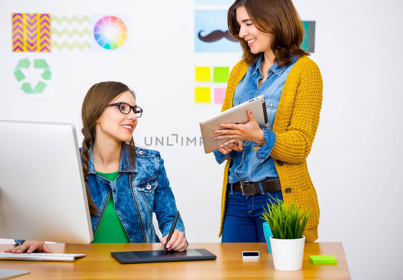 Women working at desk In a creative office, team work