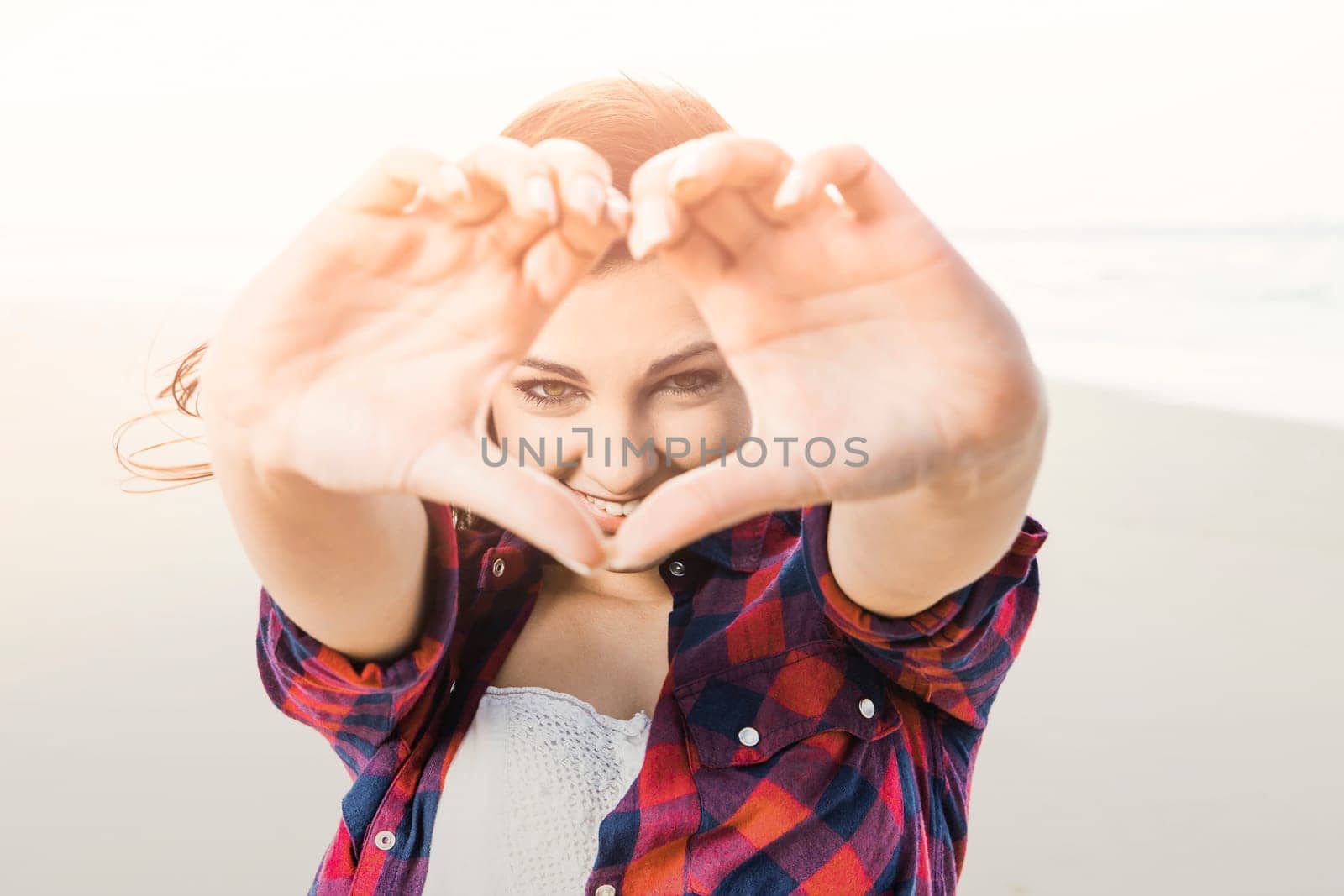 Portrtait of a happy girl at the beach enjoying the life
