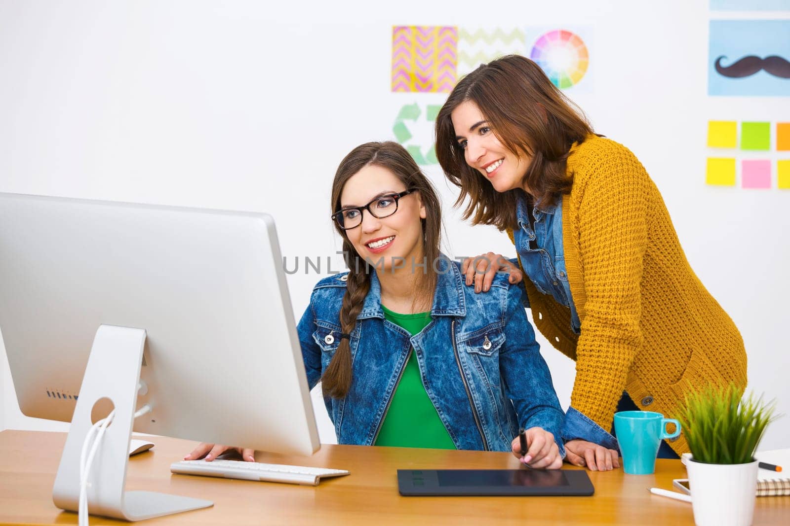 Women working at desk In a creative office, team work