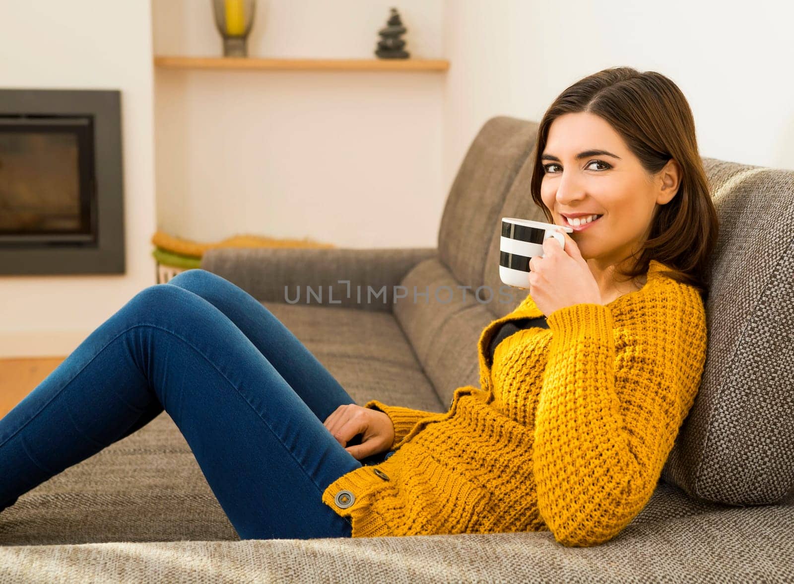 Beautiful woman at home Having a good time with cup a coffee