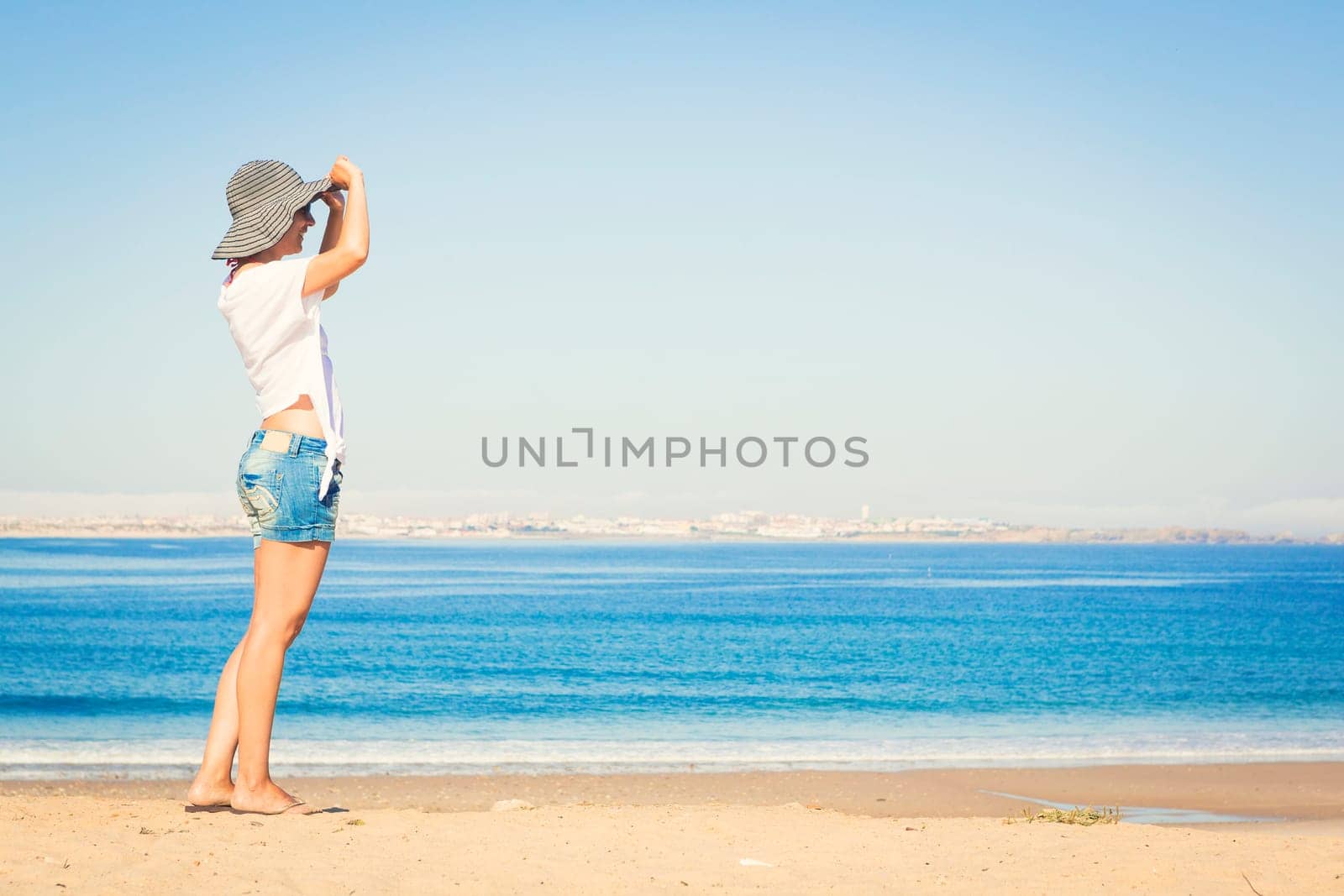 Beautiful young woman enjoying the beach