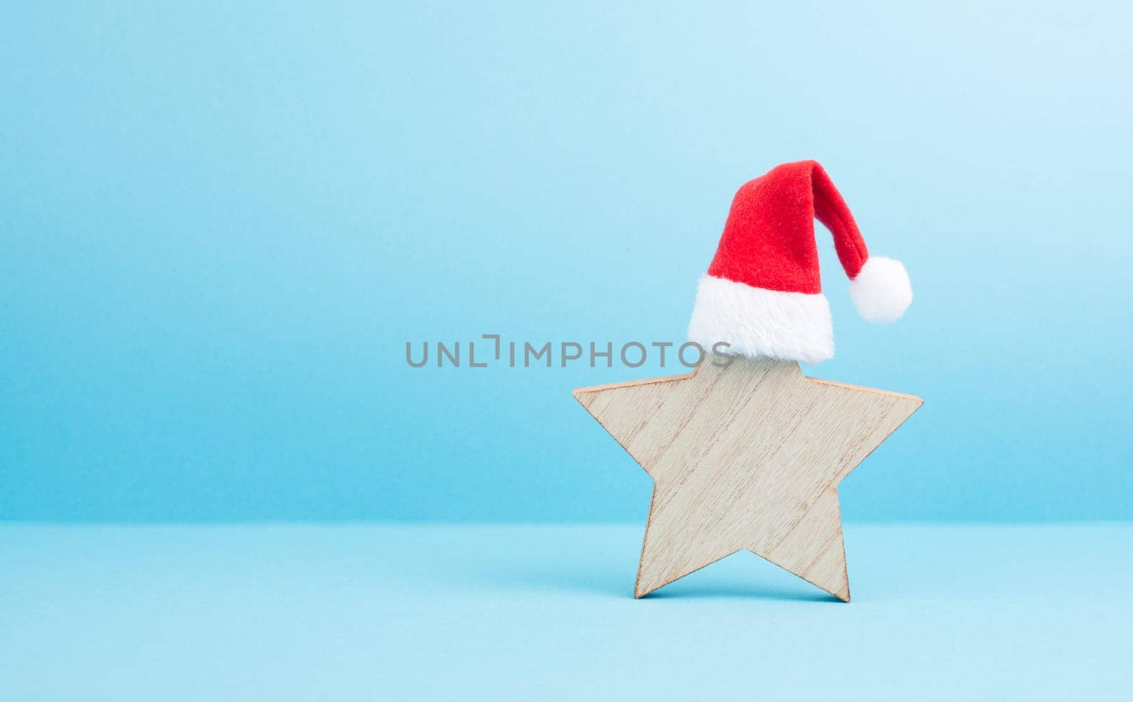 Star with a red christmas hat, winter greeting card and banner, copy space