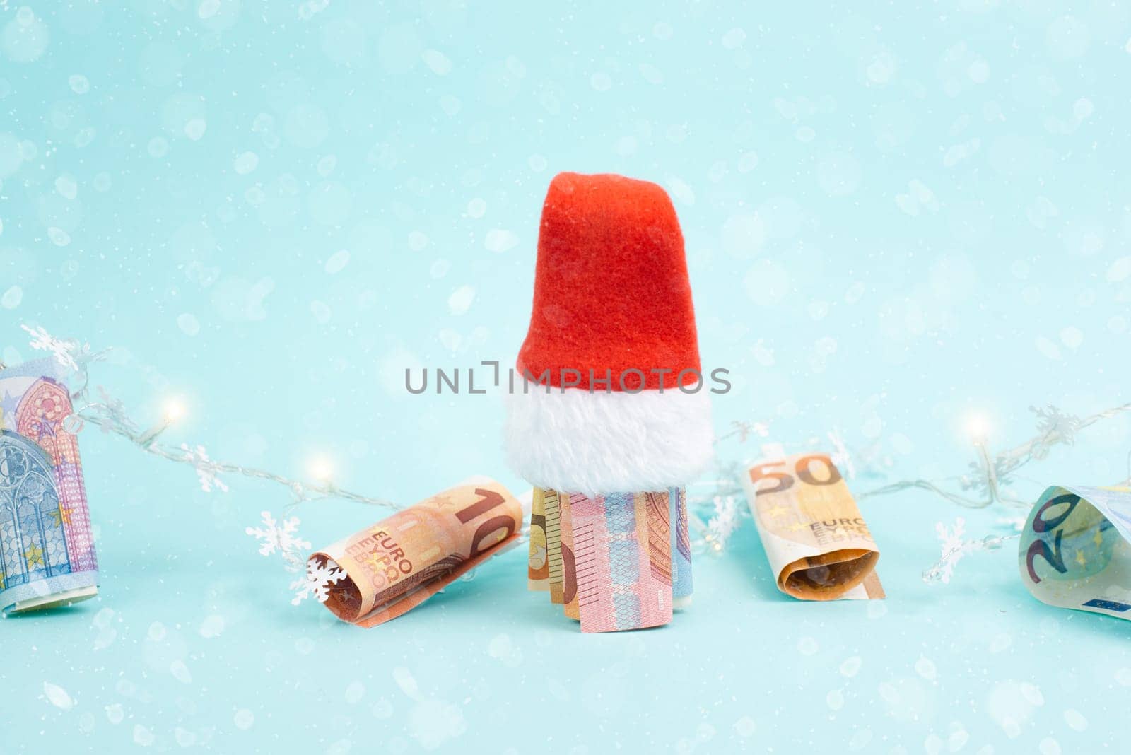 Christmas fairy lights with money, increase of electricity costs, save energy at the holiday season