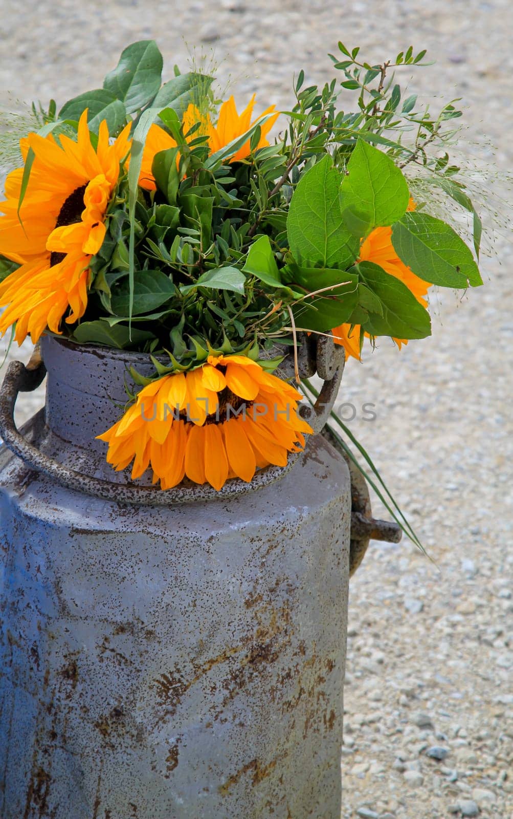 A festive decoration with beautiful yellow sunflowers.
