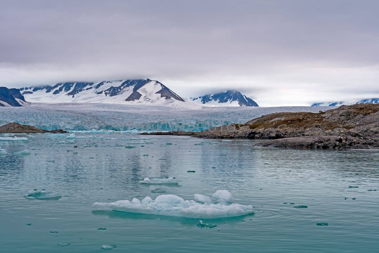 Low Clouds Over a Massive Glacier at Lilliehookfjorden in the Svalbard Islands in Norway