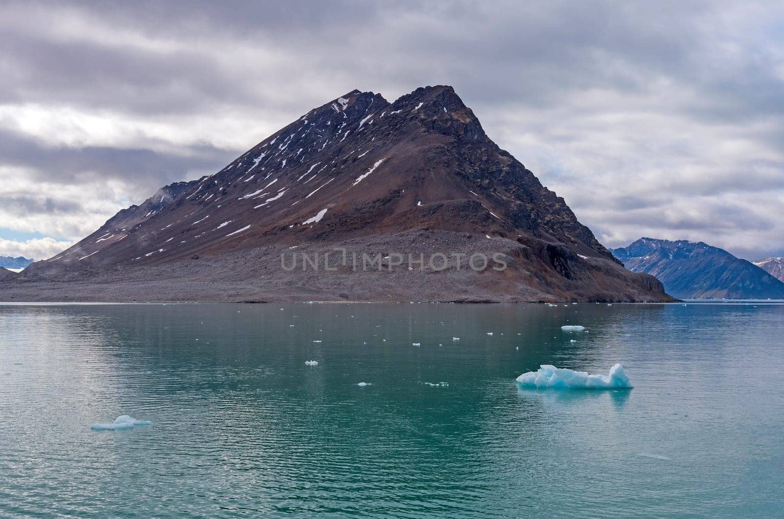 Barren Rock and Icy Waters at Lilliehookfjorden in the Svalbard islands in Norway
