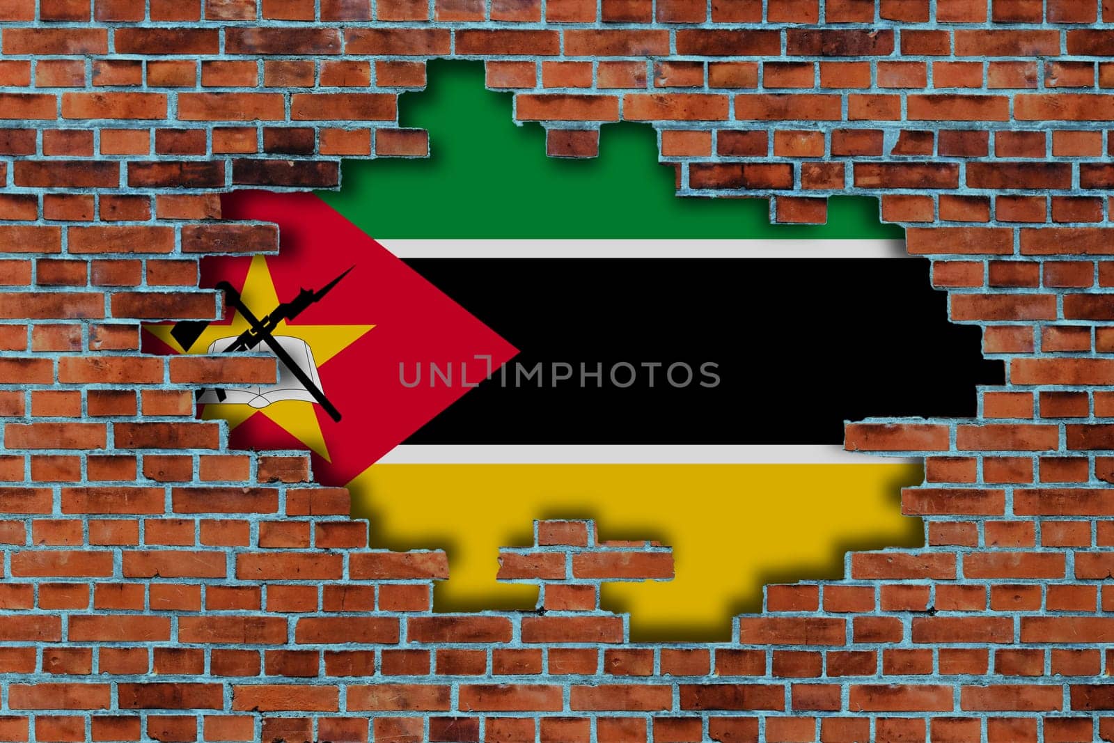 3D Flag of Mozambique behind the broken old stone wall background.
