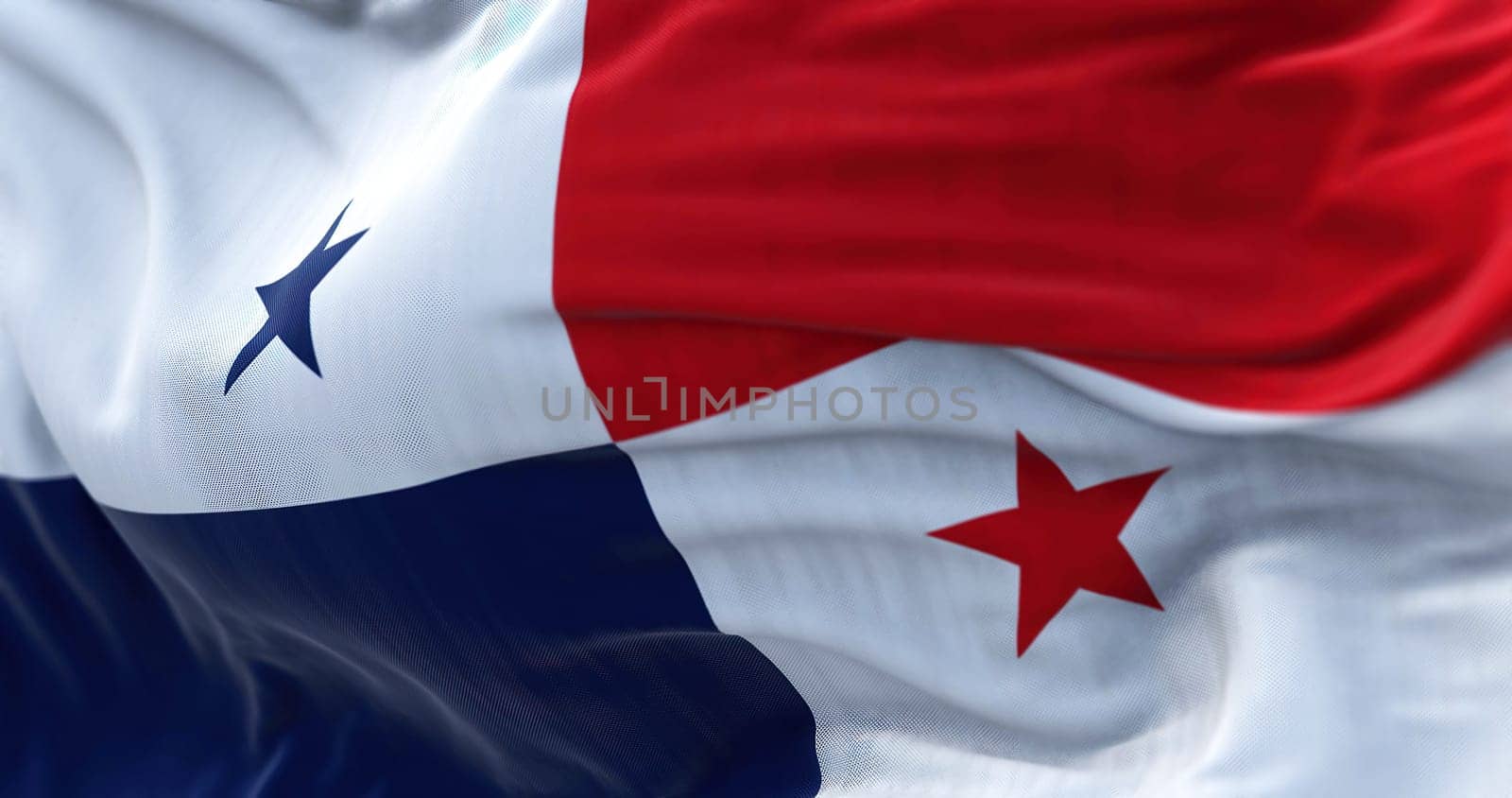 Close-up view of the Panama national flag waving in the wind. The Republic of Panama is a State of Central America. Fabric textured background. Selective focus