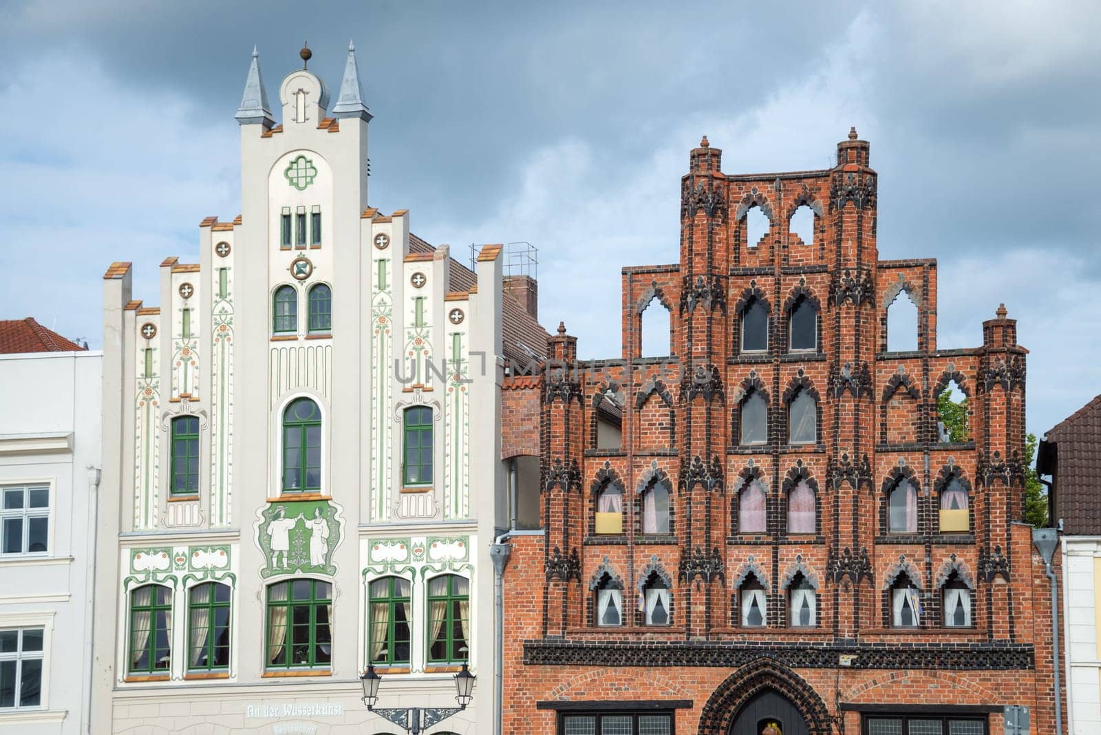 Renovated old house with ornate dormer windows and a beautiful facade in the old town of Wismar. Germany
