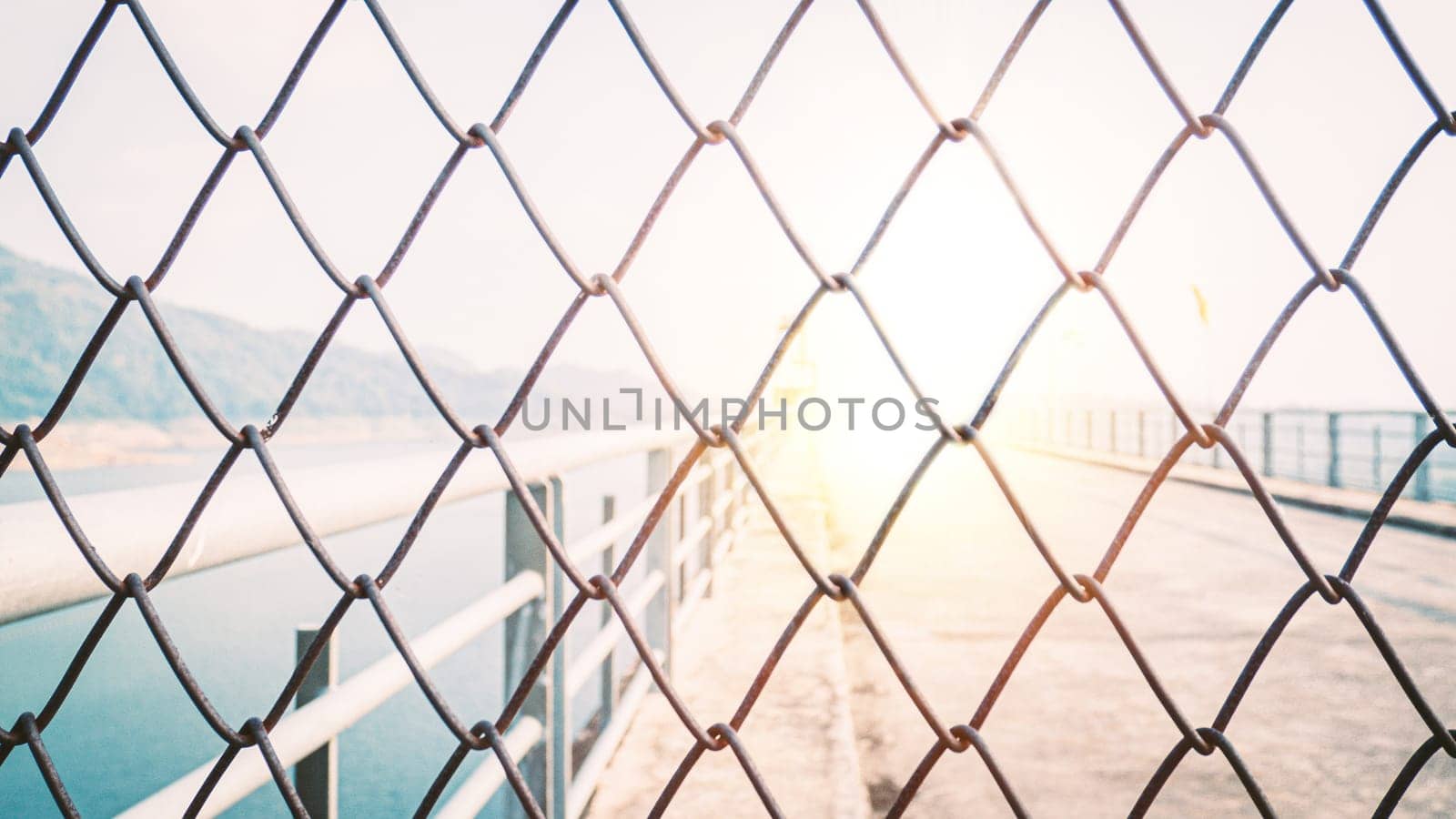 Chainlink fence. Wire fence. Metal net. Wire mesh. Metal grater grille background.
