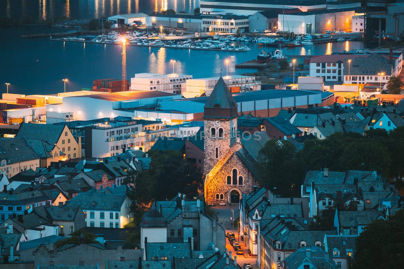 Alesund, Norway. Night View Of  Alesund Skyline Cityscape. Historical Center In Summer Evening. Famous Norwegian Landmark And Popular Destination. Alesund, Kiven viewpoint, Mt. Old Alesund Church.