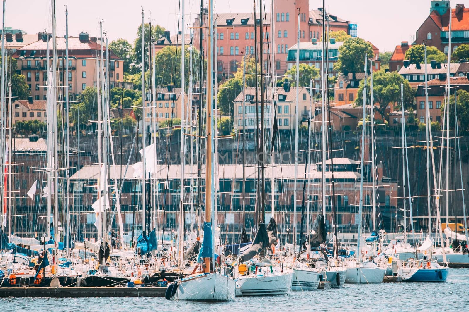 Stockholm, Sweden. Jetty With Many Moored Yachts During Summer Sailing Regatta In Sunny Day.