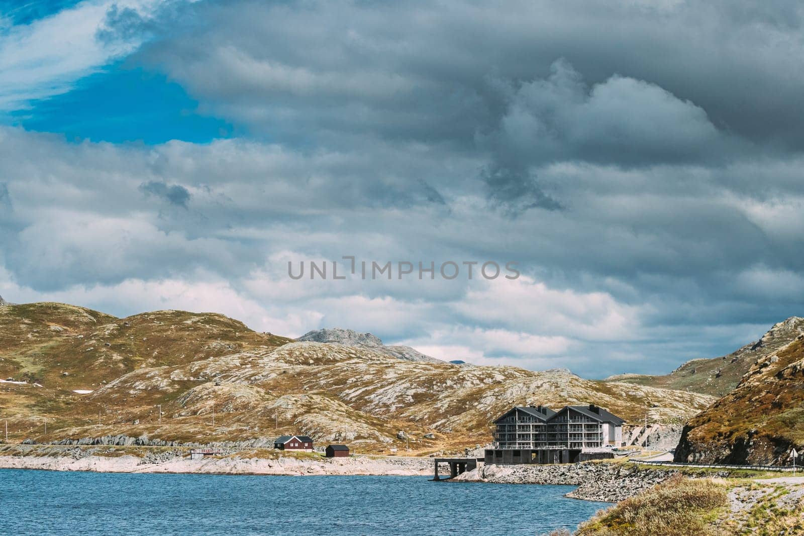 Oppland, Tyin Lake, Norway. Stones On Coast Of Beautiful Lake Tyin In Summer Cloudy Day. Norwegian Nature.