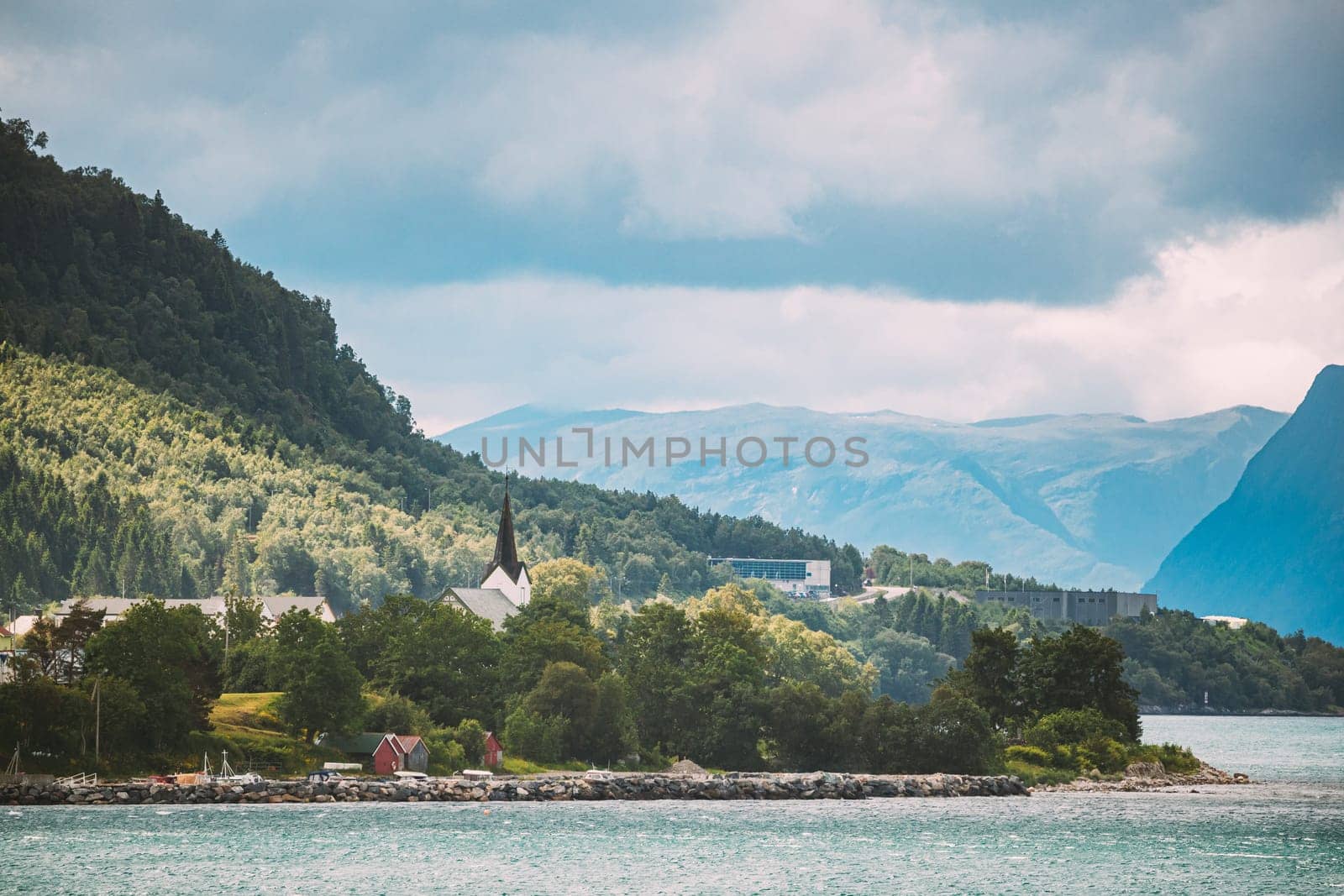Vartdal, Norway. Landscape With Vartdal Town And Old Wooden Church. Church. Skyline Cityscape In Sunny Summer Day. More og Romsdal county.