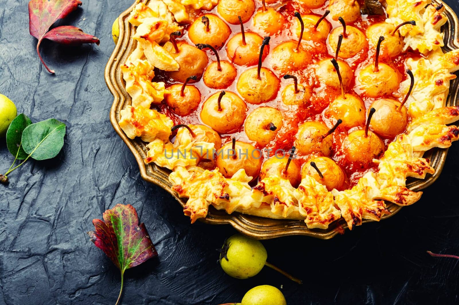 Homemade autumn pie, cake decorated with autumn pear on rustic table