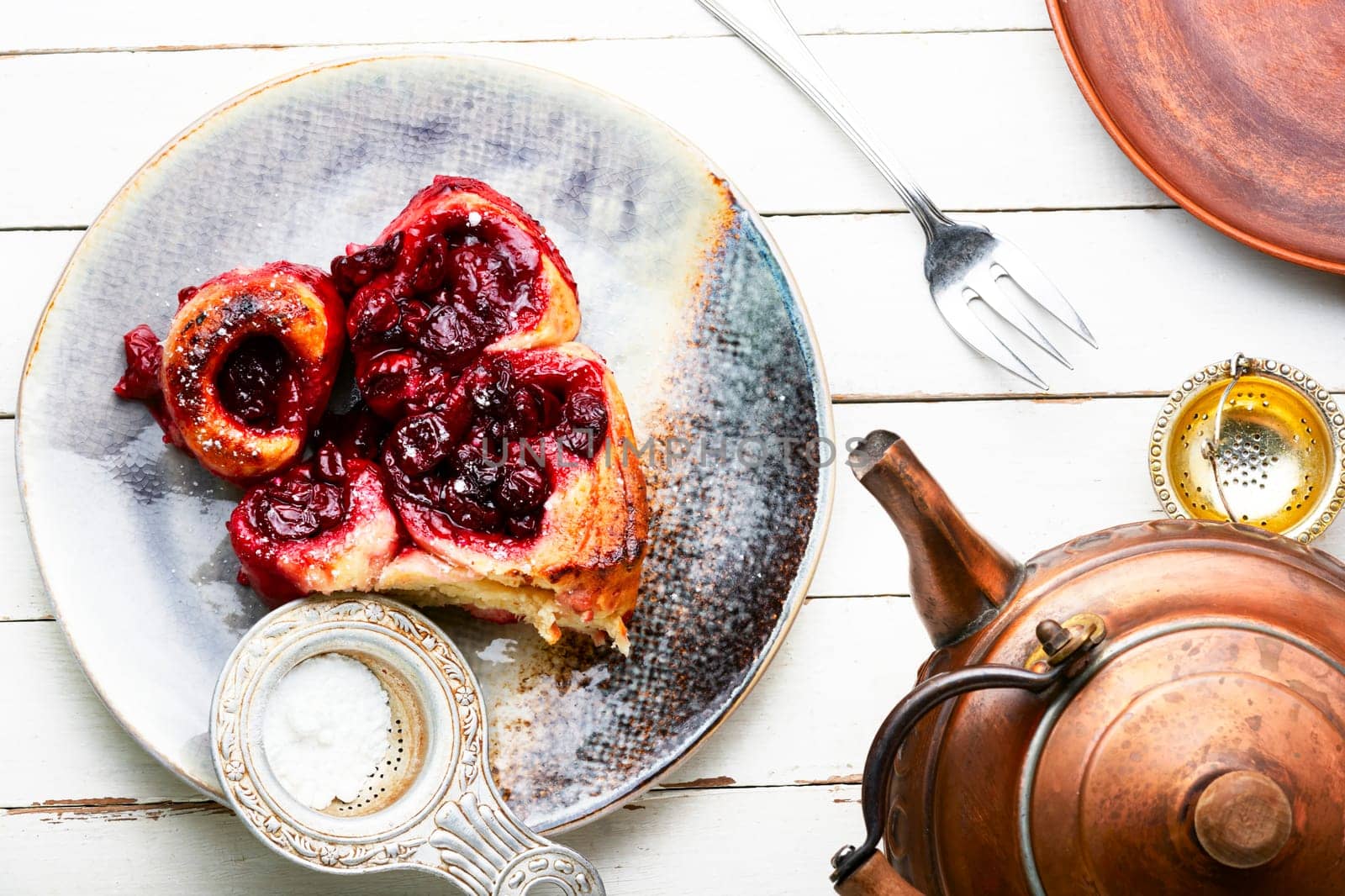 Fresh cottage cheese pie with cherry on rustic wooden table