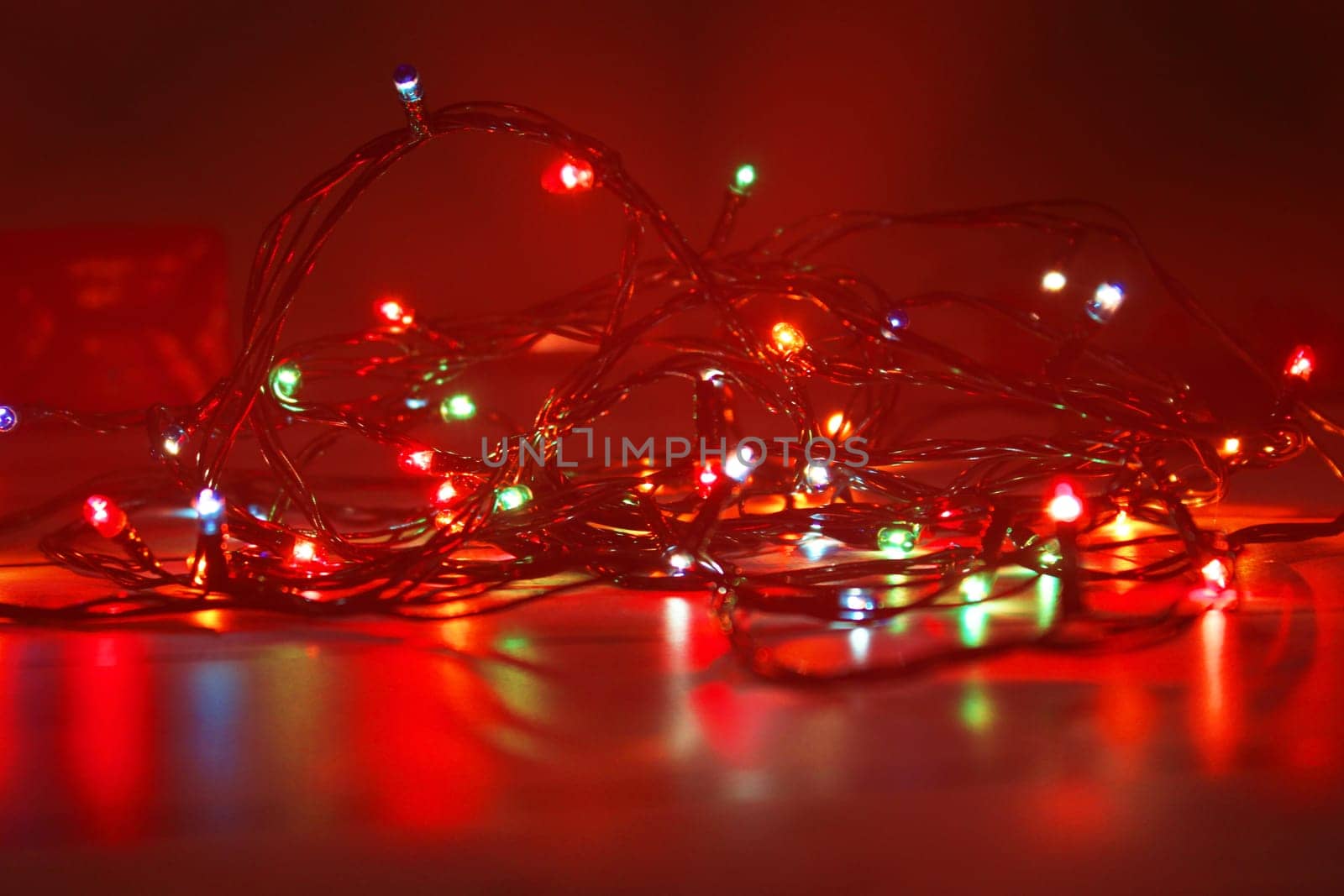Christmas garland on a dark background. Concept of christmas, new year. Blurred background, out of focus.