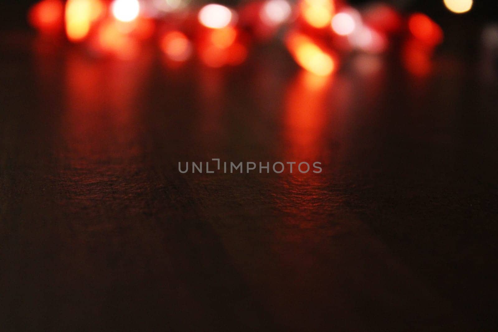 Christmas garland out of focus in the background. Universal holiday background. Concept of christmas, new year. Blurred background, out of focus.