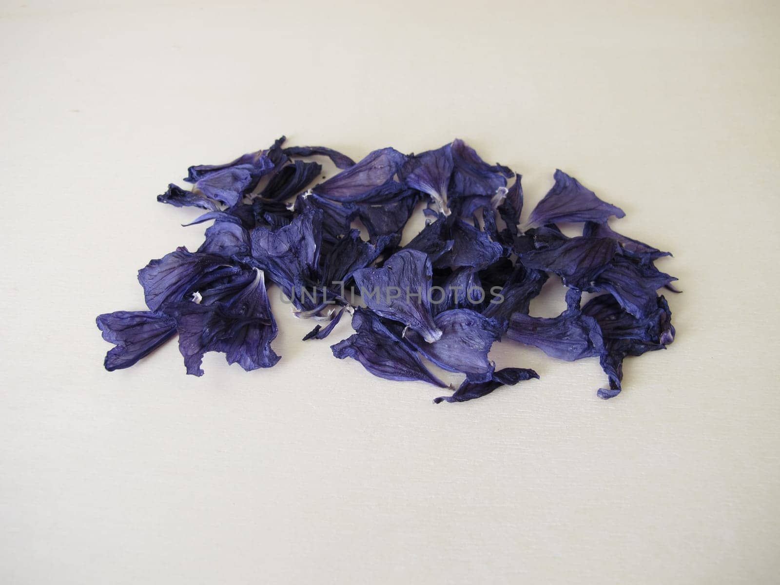 Dried mallow flowers on a wooden board