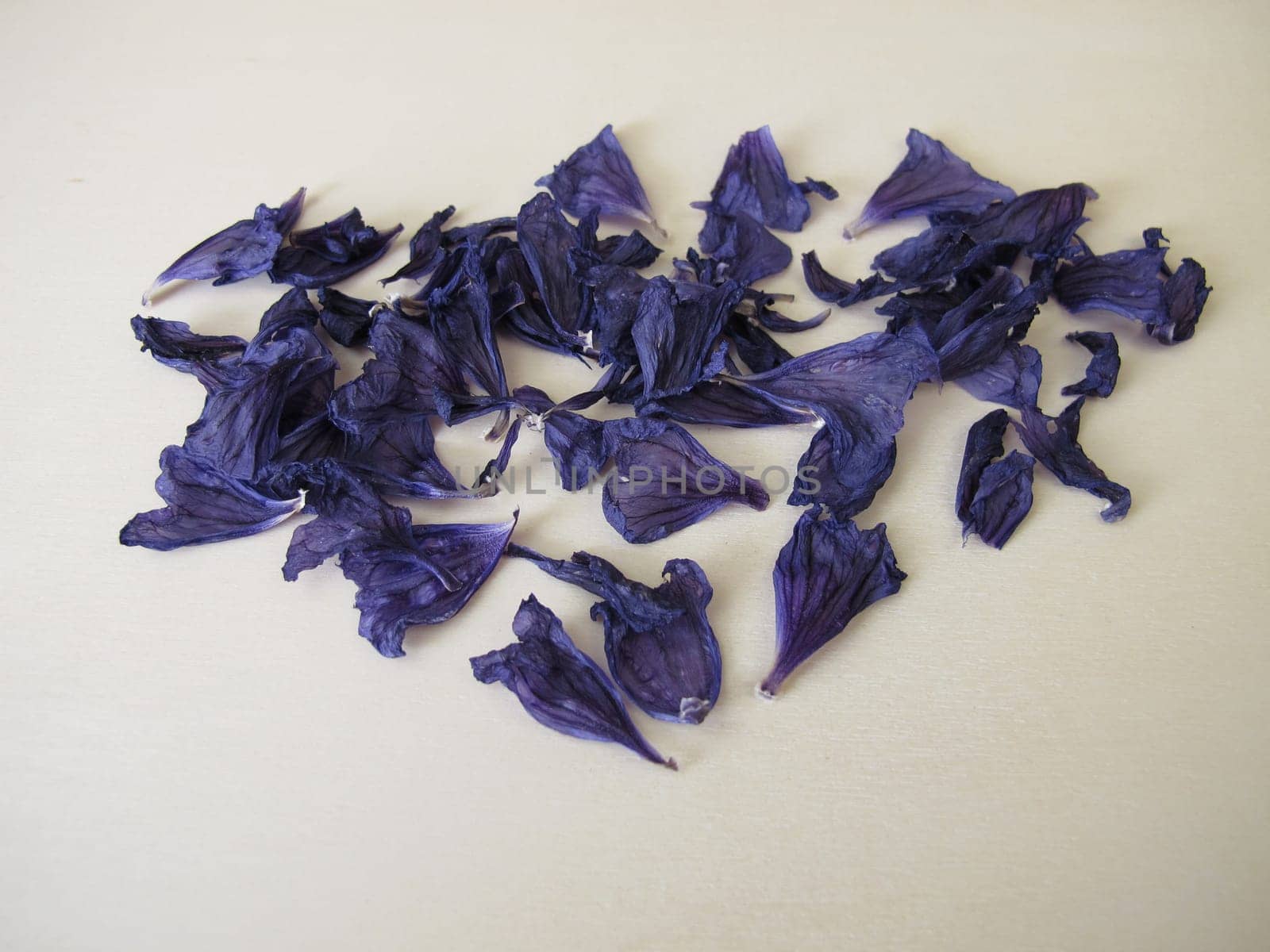 Dried mallow flowers on a wooden board