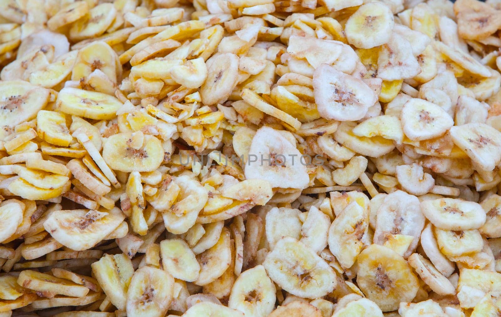 Dried banana fruit slices. Product displayed at street market stall