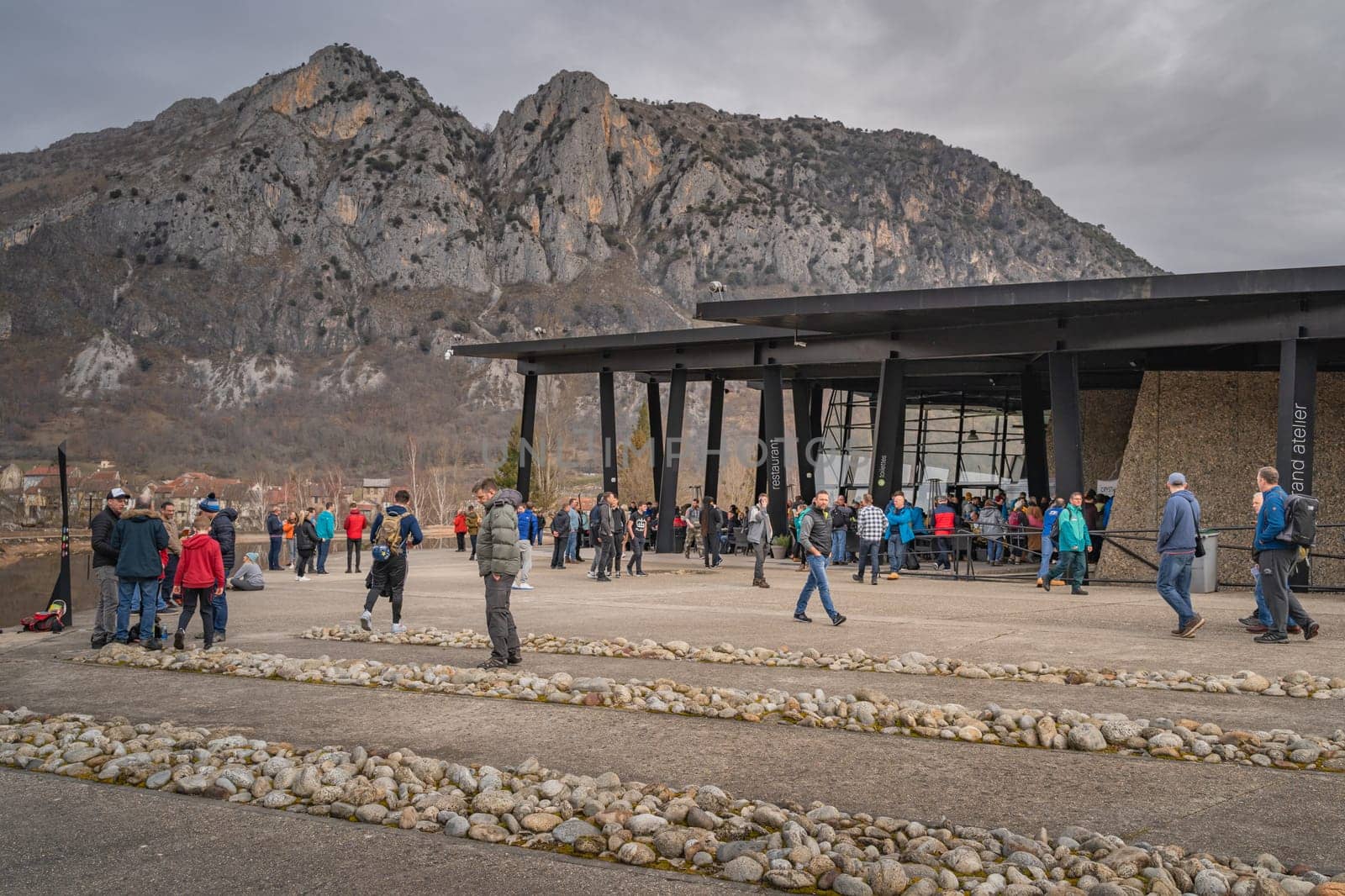 Tarascon sur Ariege, France, Jan 2020 People in a restaurant, stretching legs before hitting the road to reach their destination in Pyrenees mountains