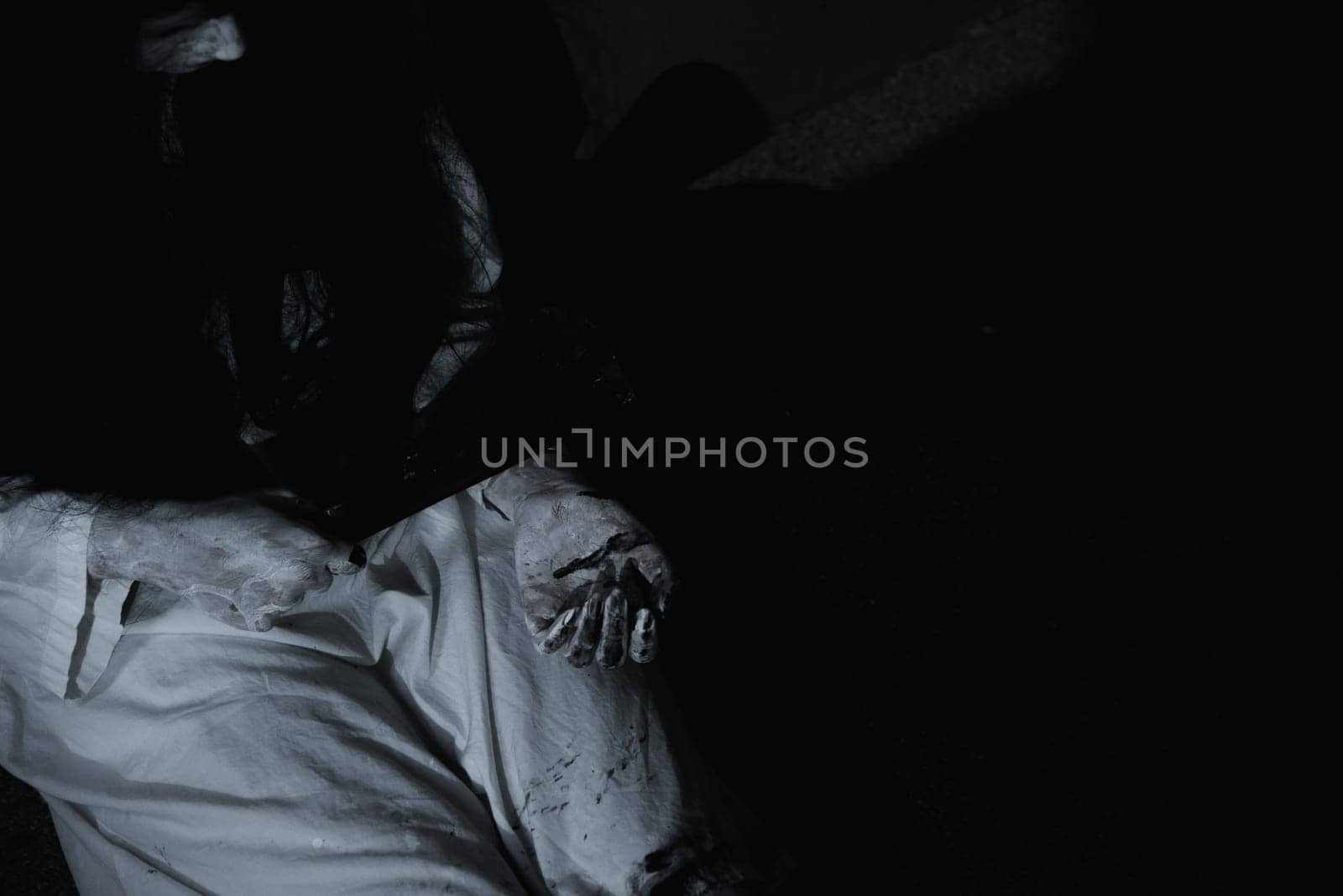 Woman ghost horror sitting her have knife arm in the house, halloween concept