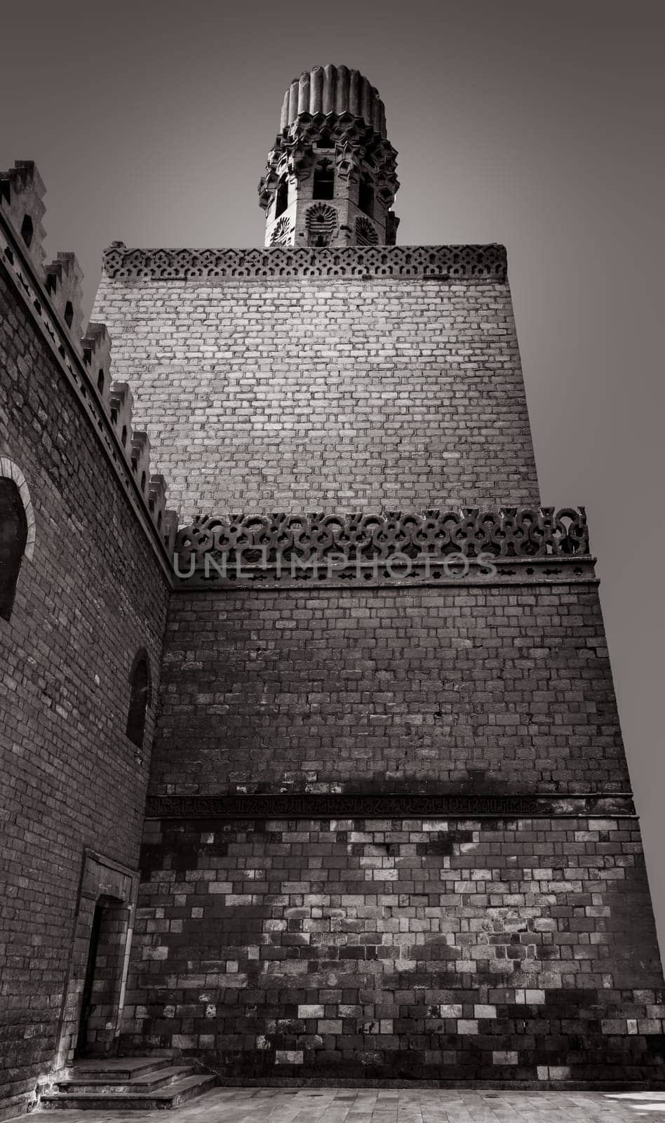 Minaret of Al Hakem mosque (The Enlightened Mosque) is a major Islamic religious site in Cairo, Egypt. named after Imam Al-Hakim bi-Amr Allah (985–1021), the sixth Fatimid caliph,16th Fatimid/Ismaili Imam and the first to be born in Egypt, located in Islamic Cairo, on the east side of Muizz Street, just south of Bab Al-Futuh. The mosque have two minarets that stood independent of the brick walls at the corners. These are the earliest surviving minarets in the city and they have been restored at various times