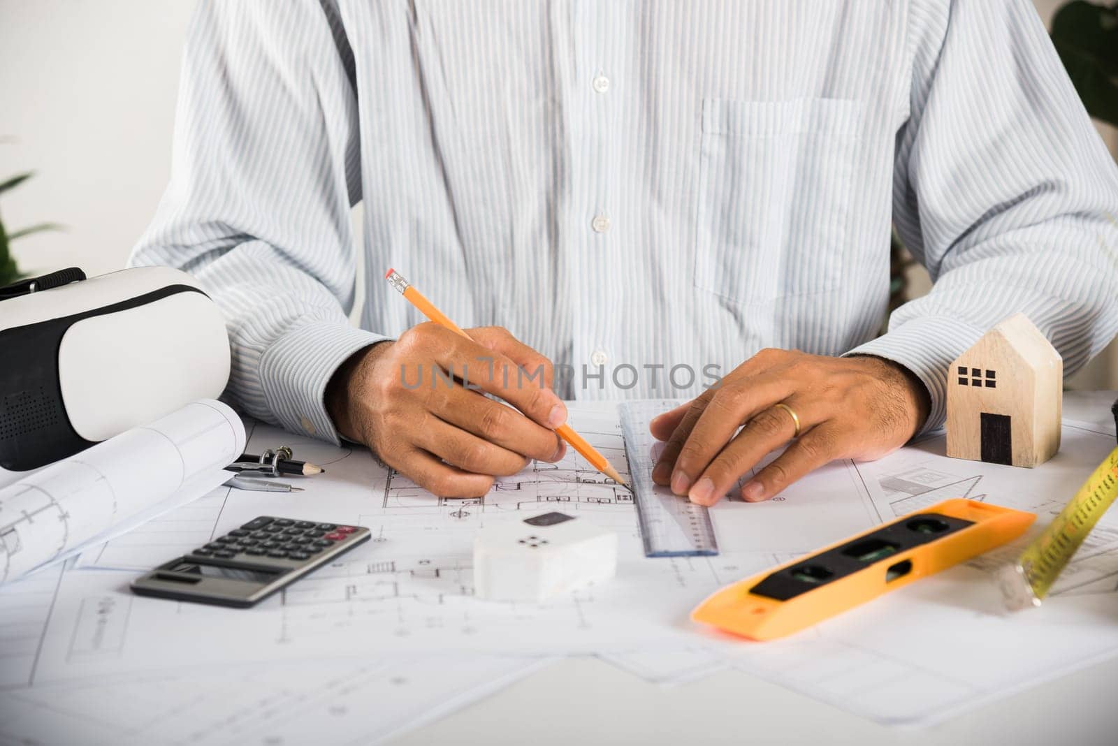 Architect workplace. Architectural building design and construction plans with blueprints paper project plans VR glasses, designing man edit a building or architecture with ruler, technology industry