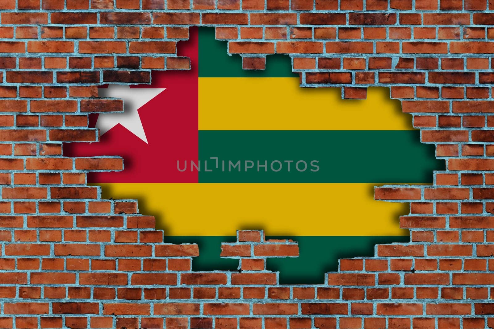 3D Flag of Togo behind the broken old stone wall background.
