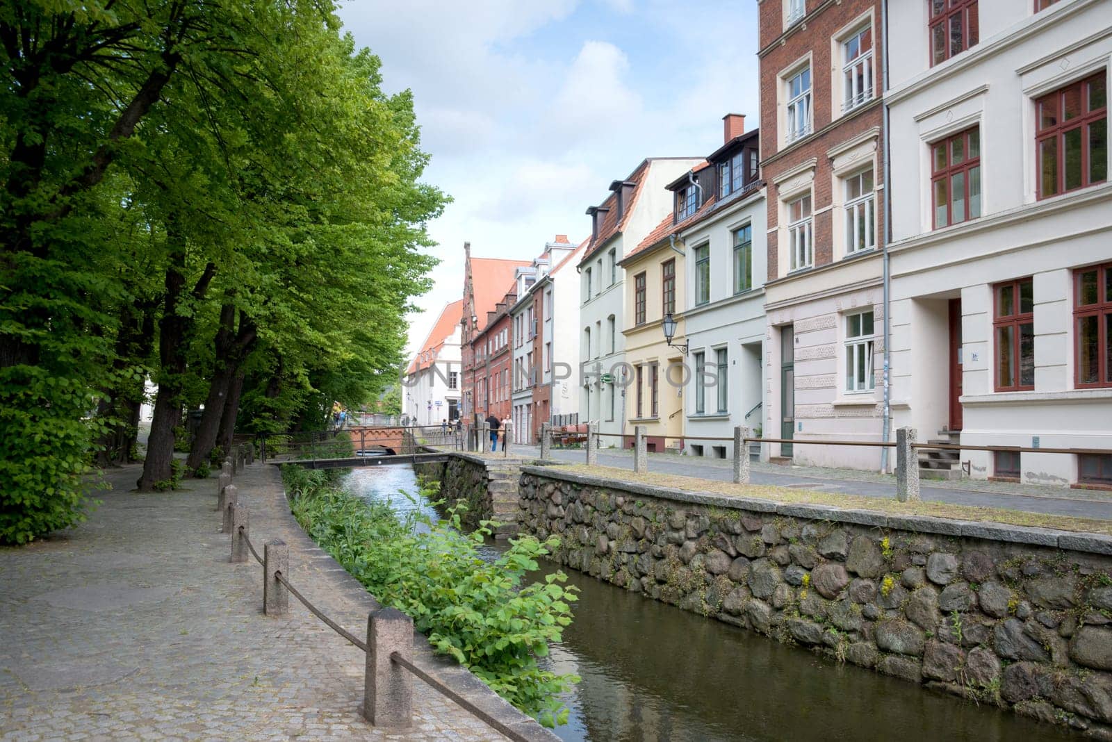 On the streets of Wismar old town. Colorful houses along the canal of Grube river, Wismar city, Mecklenburg-Vorpommern state, Germany