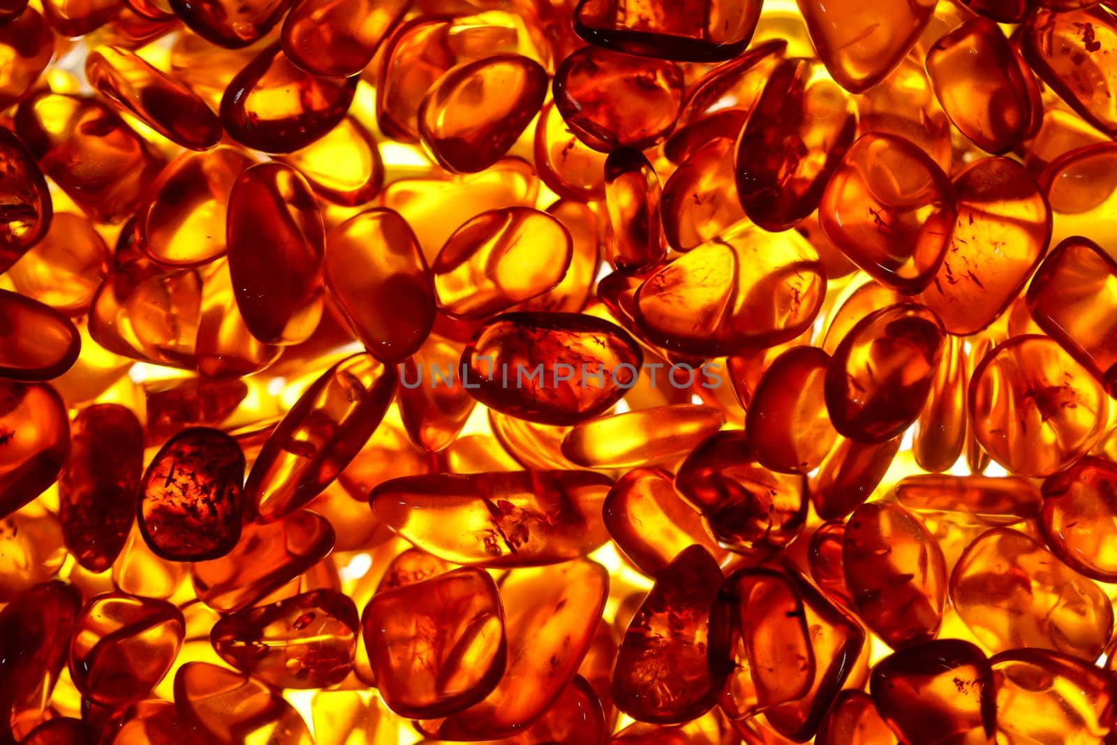 Well illuminated stones of amber which are cut.