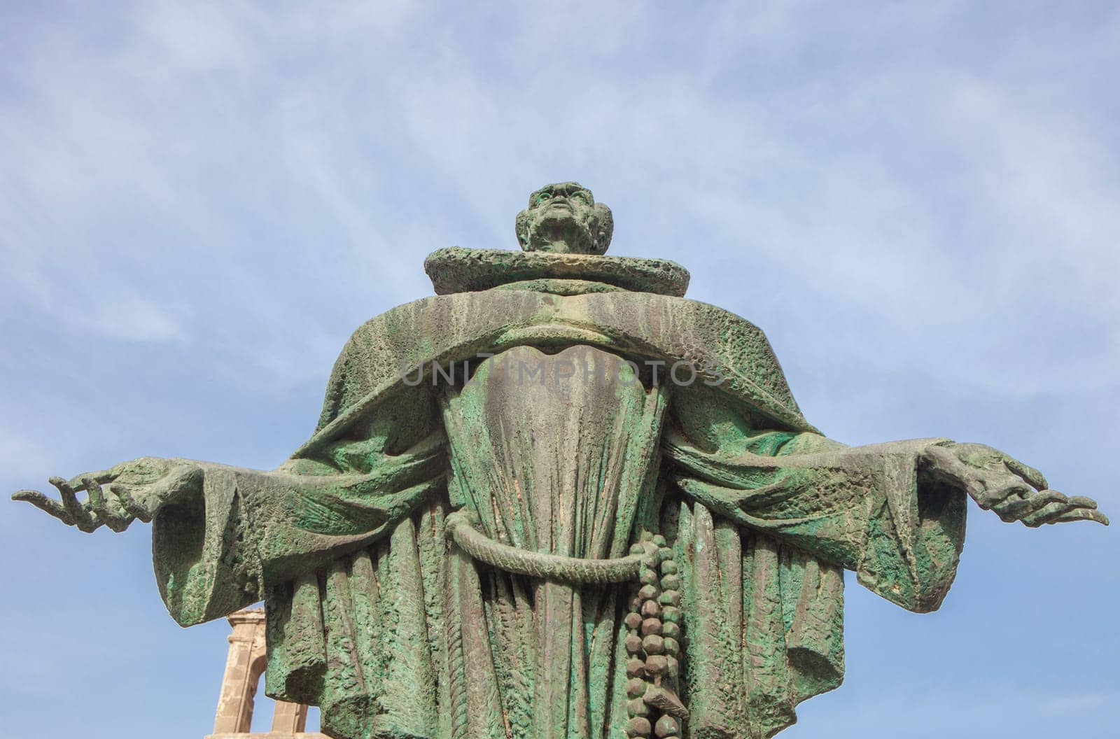 Alcantara, Spain - Oct 6th, 2022: San Pedro de Alcantara statue, Alcantara Caceres, Spain. Jose Navarro Gabaldon sculptor, 1976