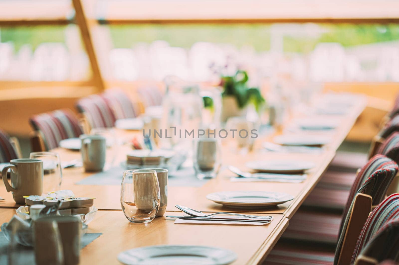 Cozy Interior Of Summer Cafe. Table And Cutlery Laid Out.