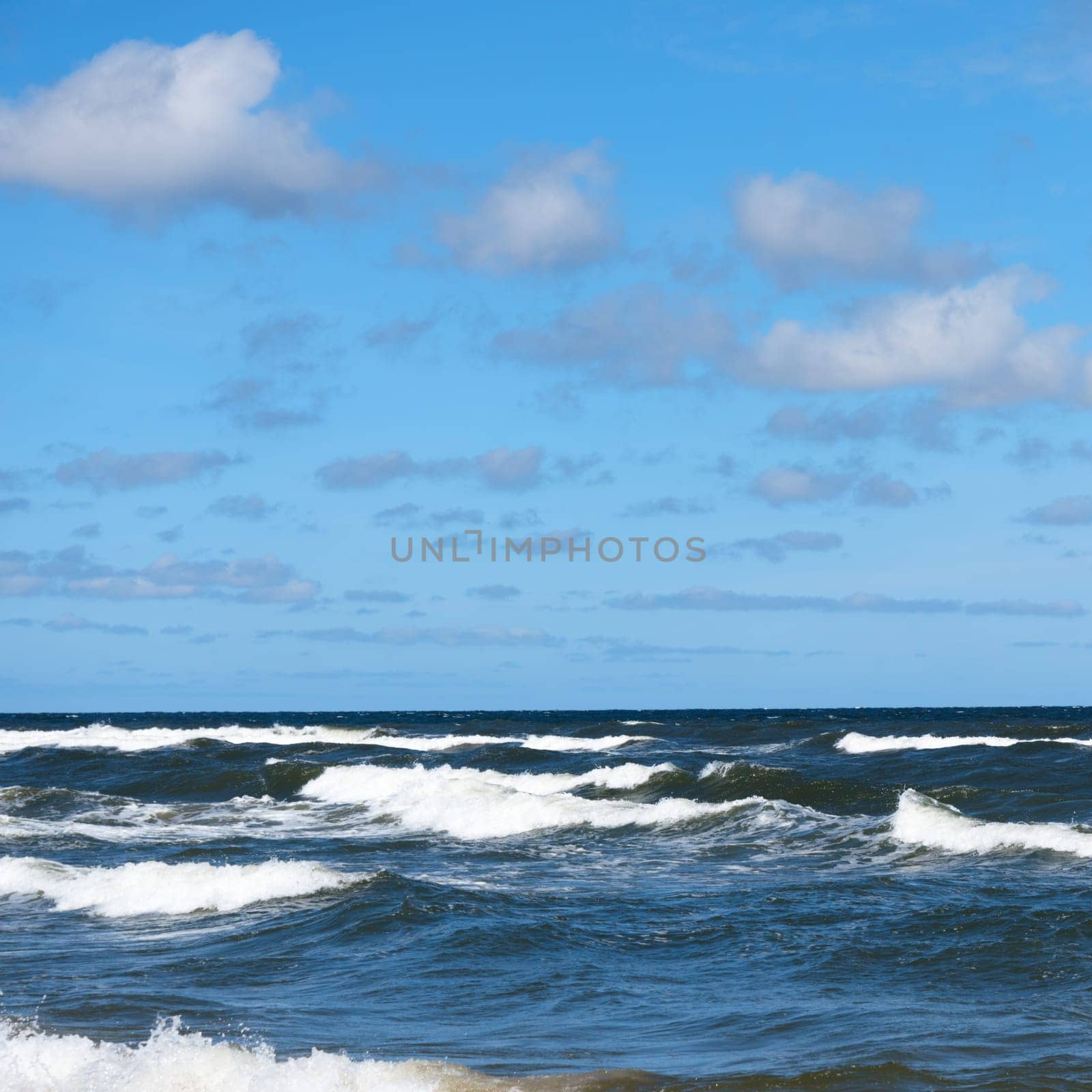 Beautiful sky and sea with waves to the horizon.