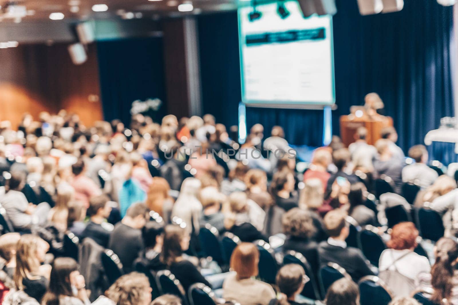 Blured image of audience in conference hall attending business conference. Business and Entrepreneurship concept.