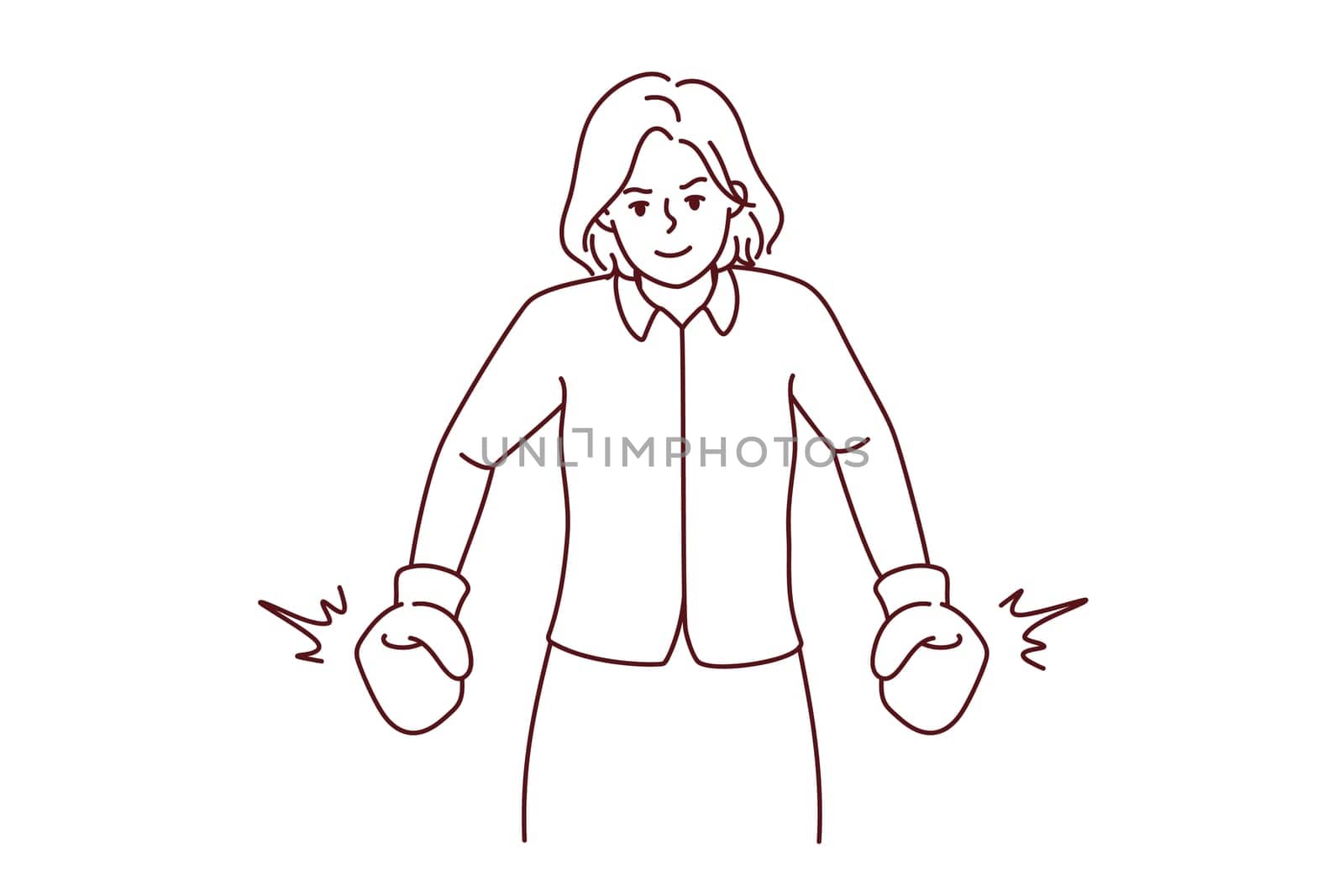 Strong businesswoman in boxing gloves