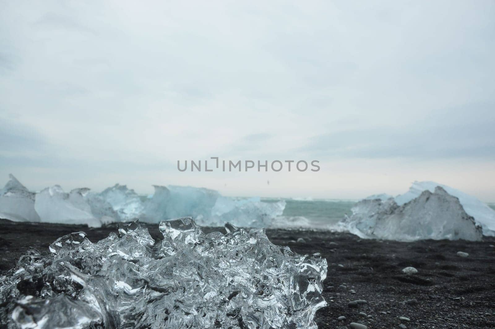 Black sand and crystal clear ice chunks at Diamond Beach in Fellsfjara, Jokulsarlon on Iceland