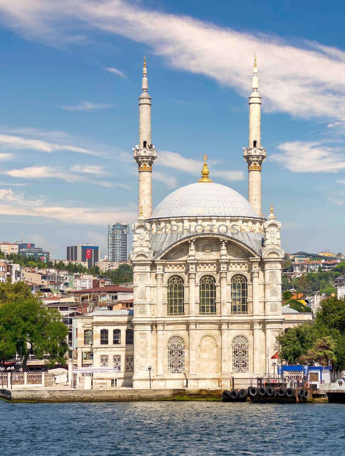 View from Bosphorus Strait overlooking Ortakoy Mosque, or Ortakoy Camii, aka Buyuk Mecidiye Camii, suited at the waterside of the Ortakoy pier square, Istanbul, Turkey