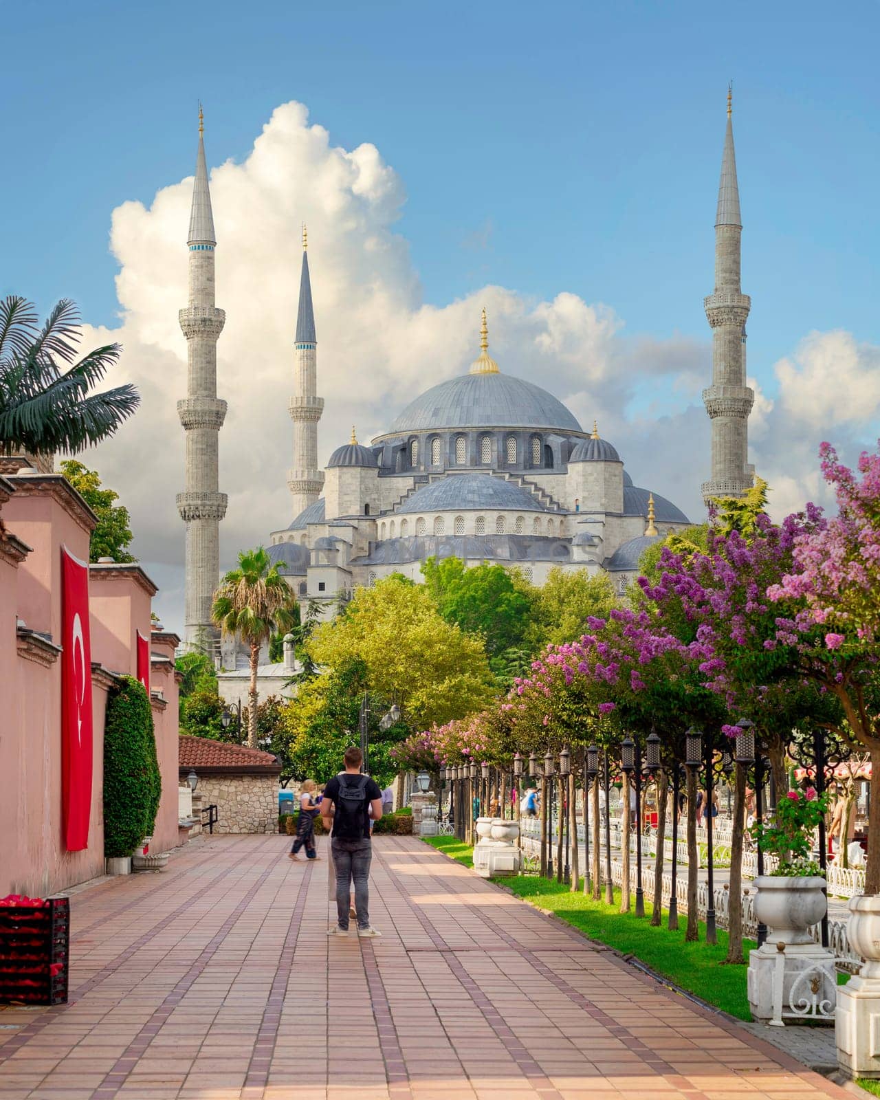 Blue Mosque, or Sultan Ahmet Mosque at crowded Sultan Ahmed square, in a summer day with tourists visiting the place, Istanbul, Turkey
