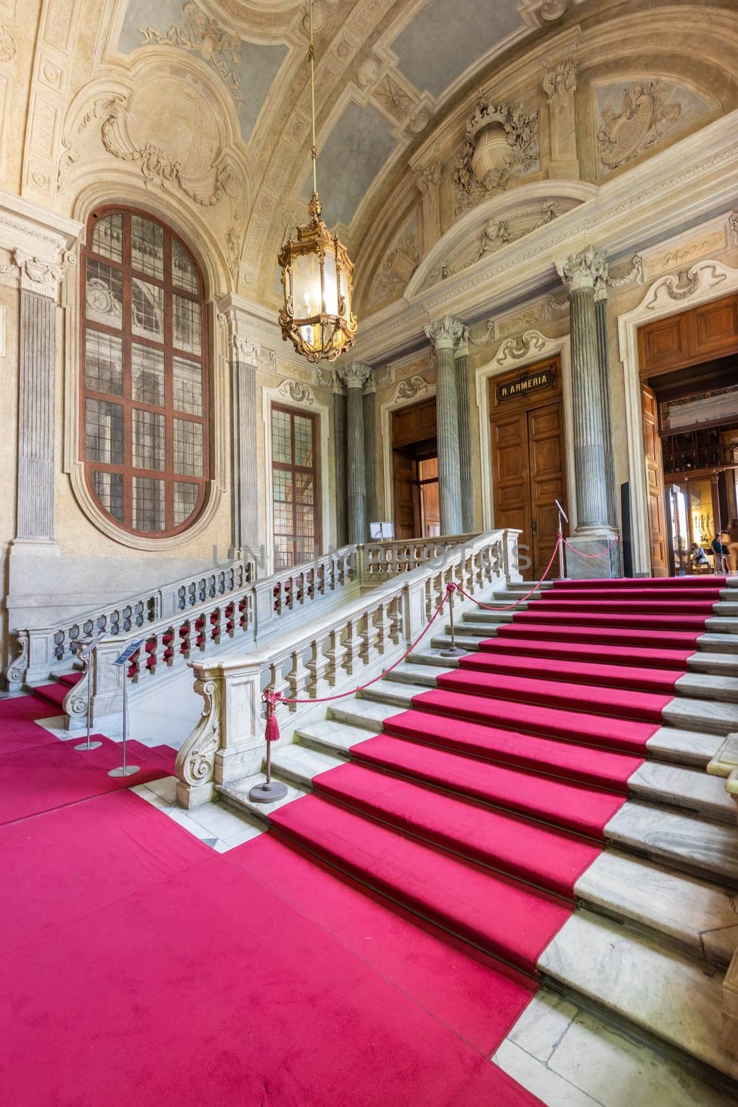 Turin, Italy - Circa August 2021: marble staircase in historic palace with luxury interior - Savoia Royal Palace