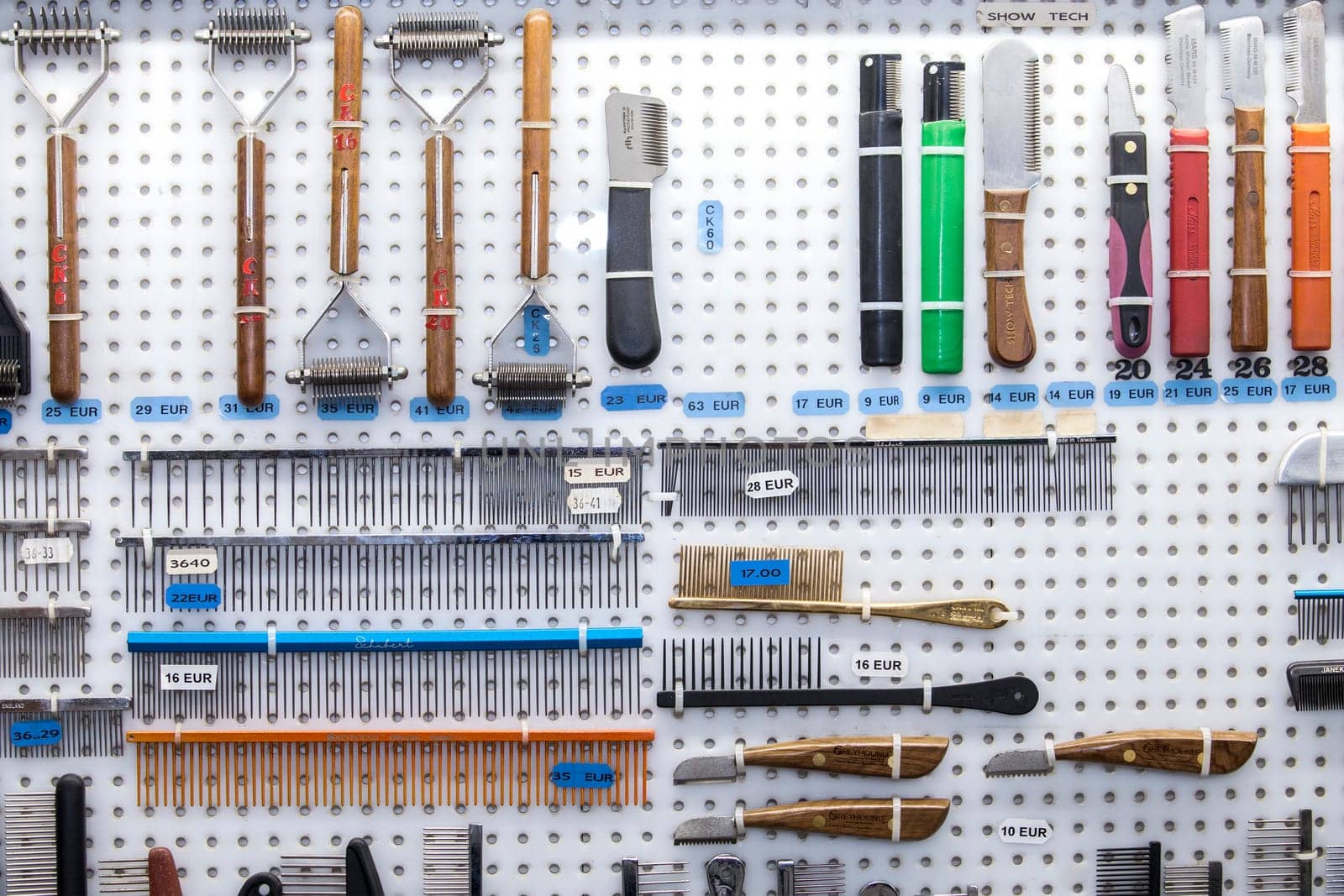 Merida, Spain - Oct 23th, 2022: Dog hair care tools for sell at exhibition enclosure. Canine International Exhibition