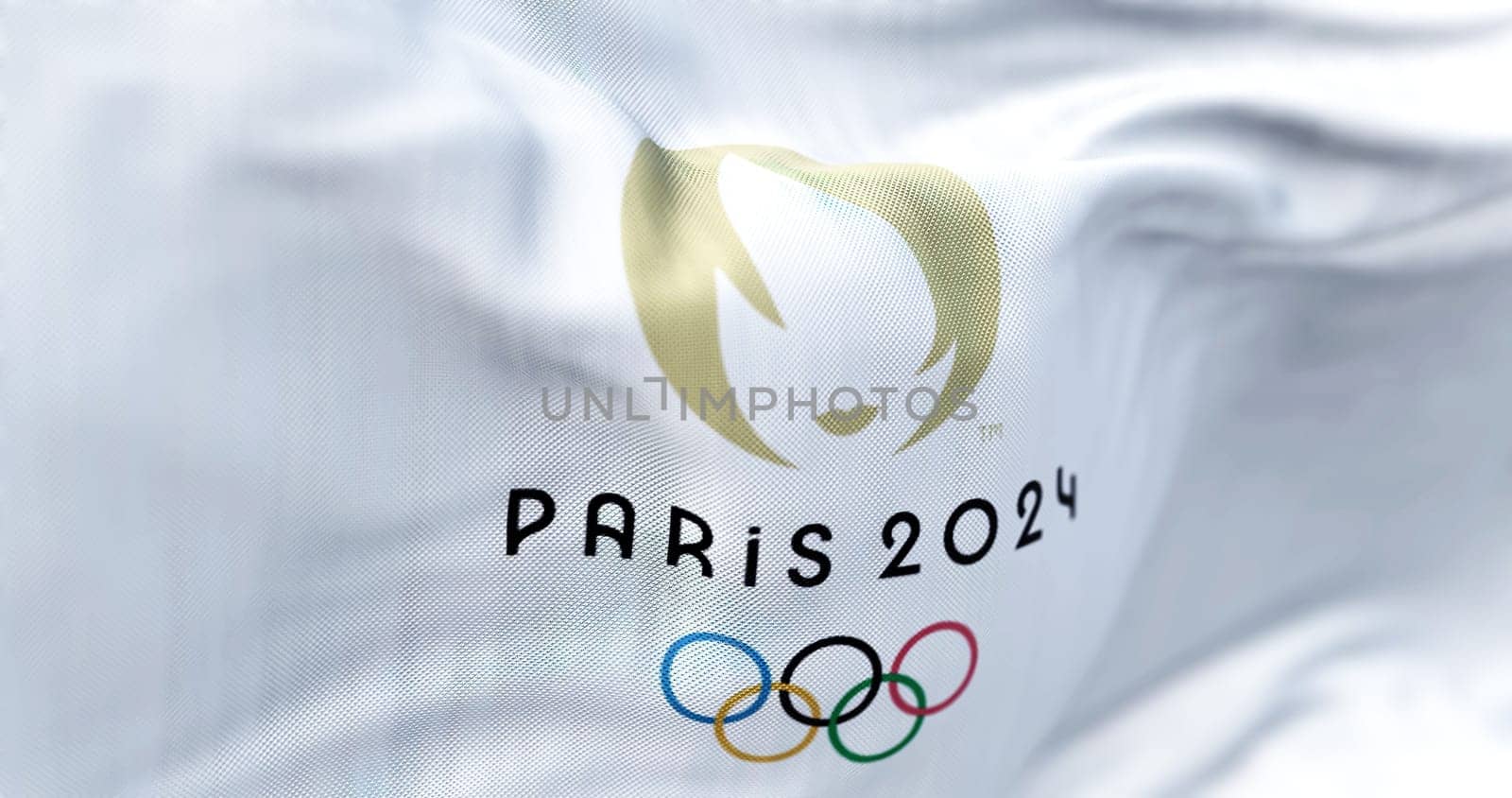 Paris, FR, October 2022: Close-up view of the Paris 2024 Summer Olympics flag waving in the wind. The XXXIII Olympic Games will be held in Paris, France, from 26 July to 11 August 2024.